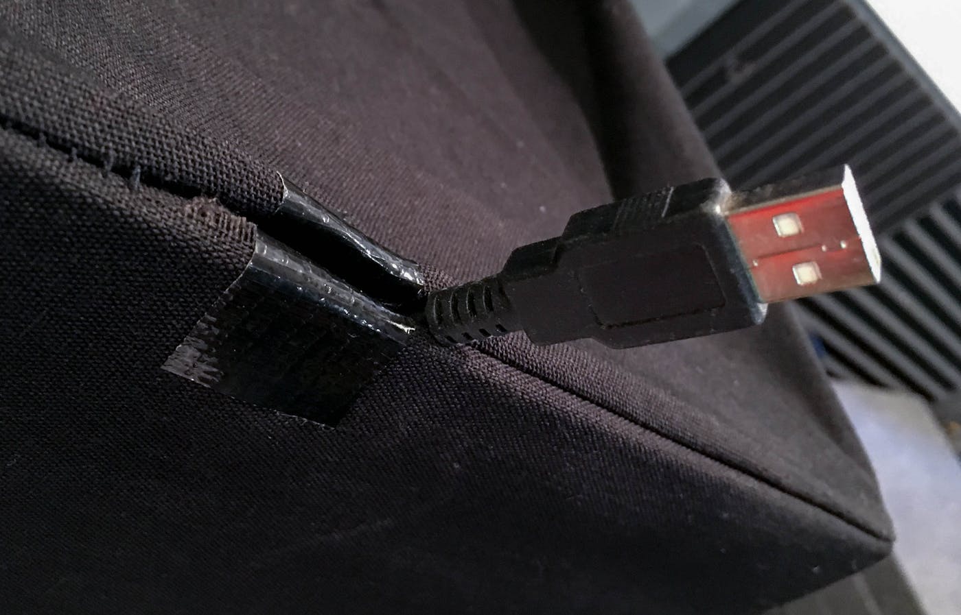 Reinforced hole for USB cord