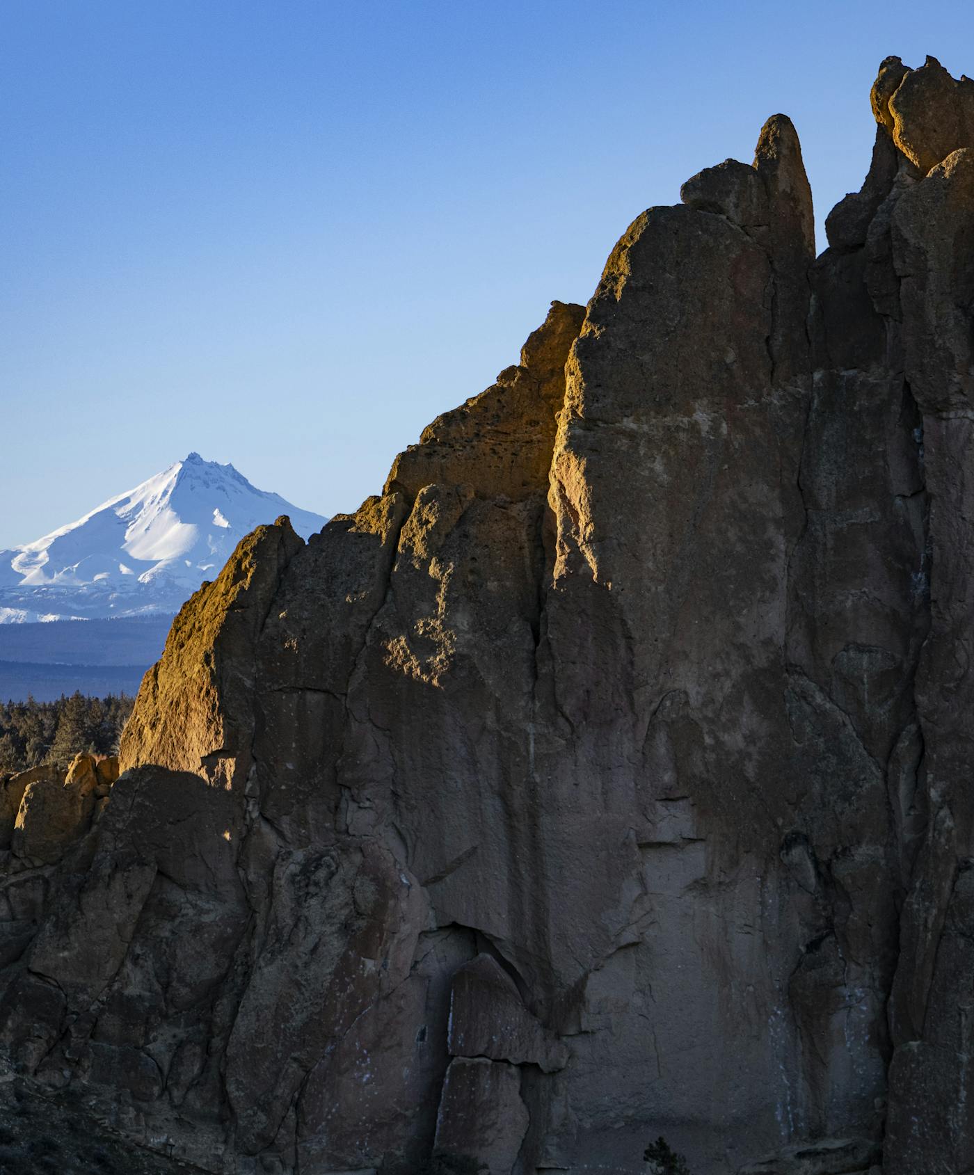 Mt. Jefferson is visible beyond the sheer 600' cliffs.