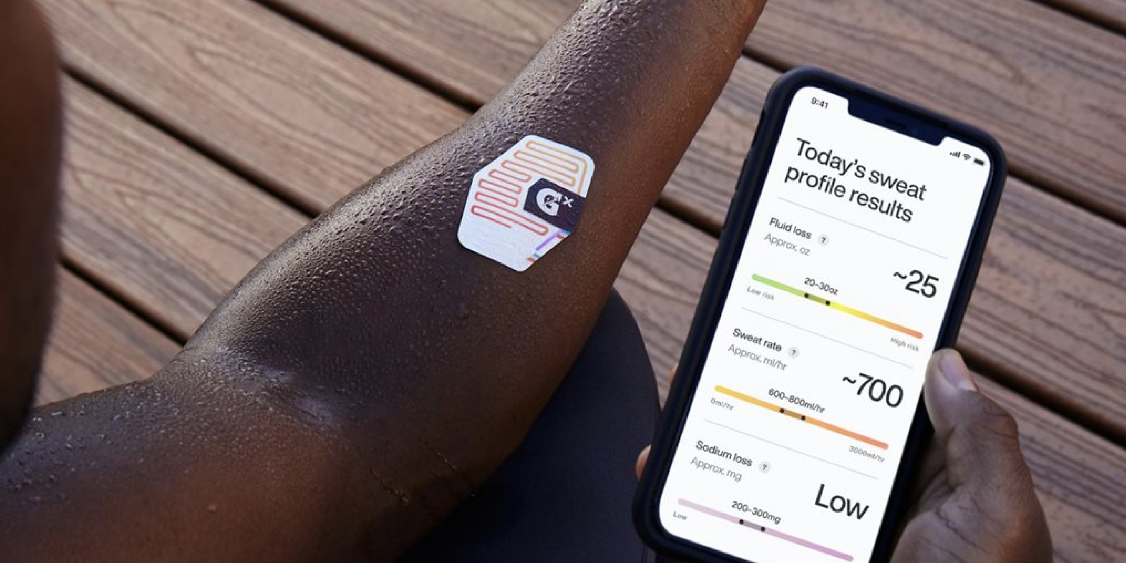 Athlete with Gx Sweat Patch on arm and viewing results on the Gx app