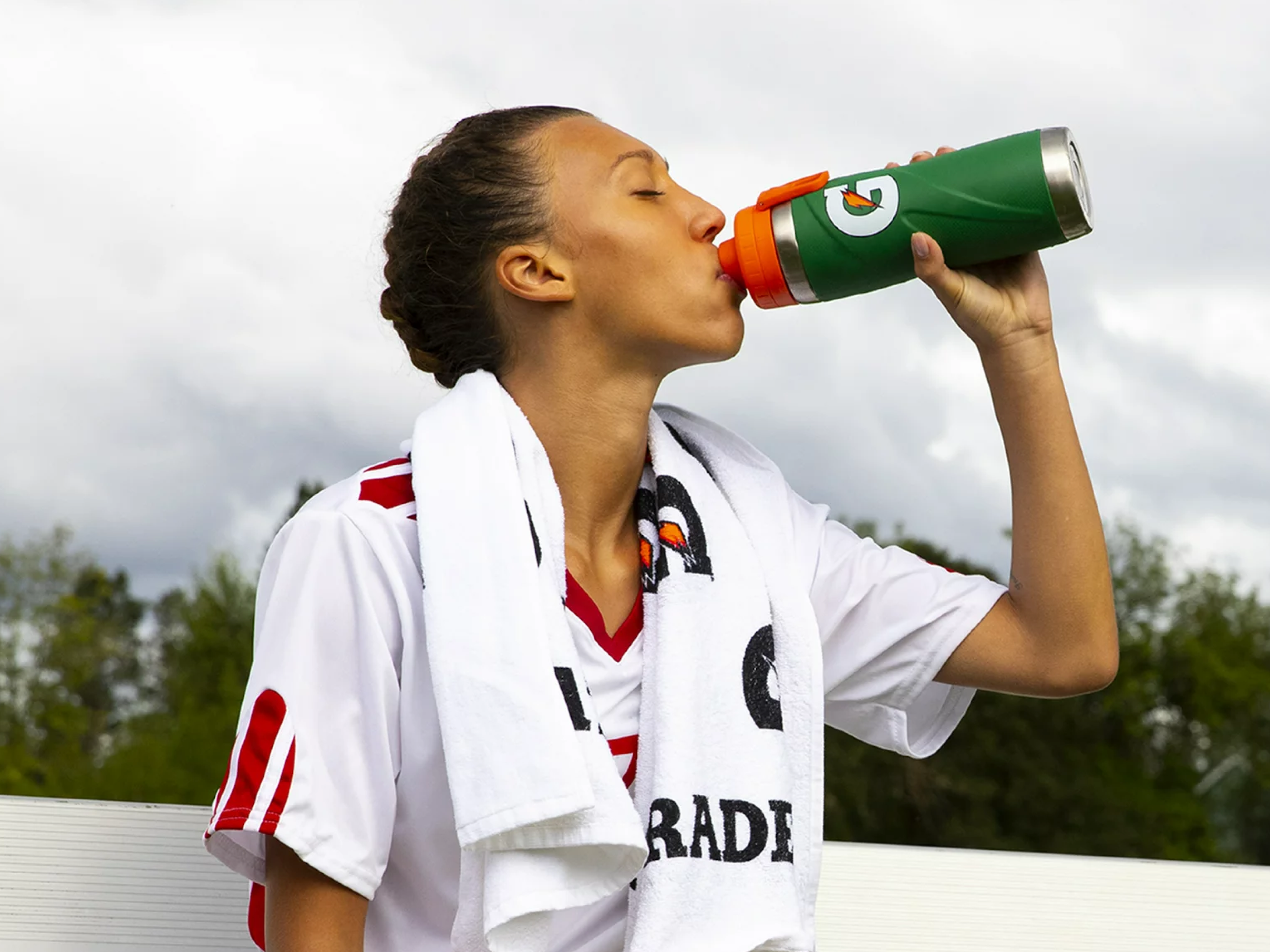 Athlete drinking out of a Gatorade Stainless Steel bottle