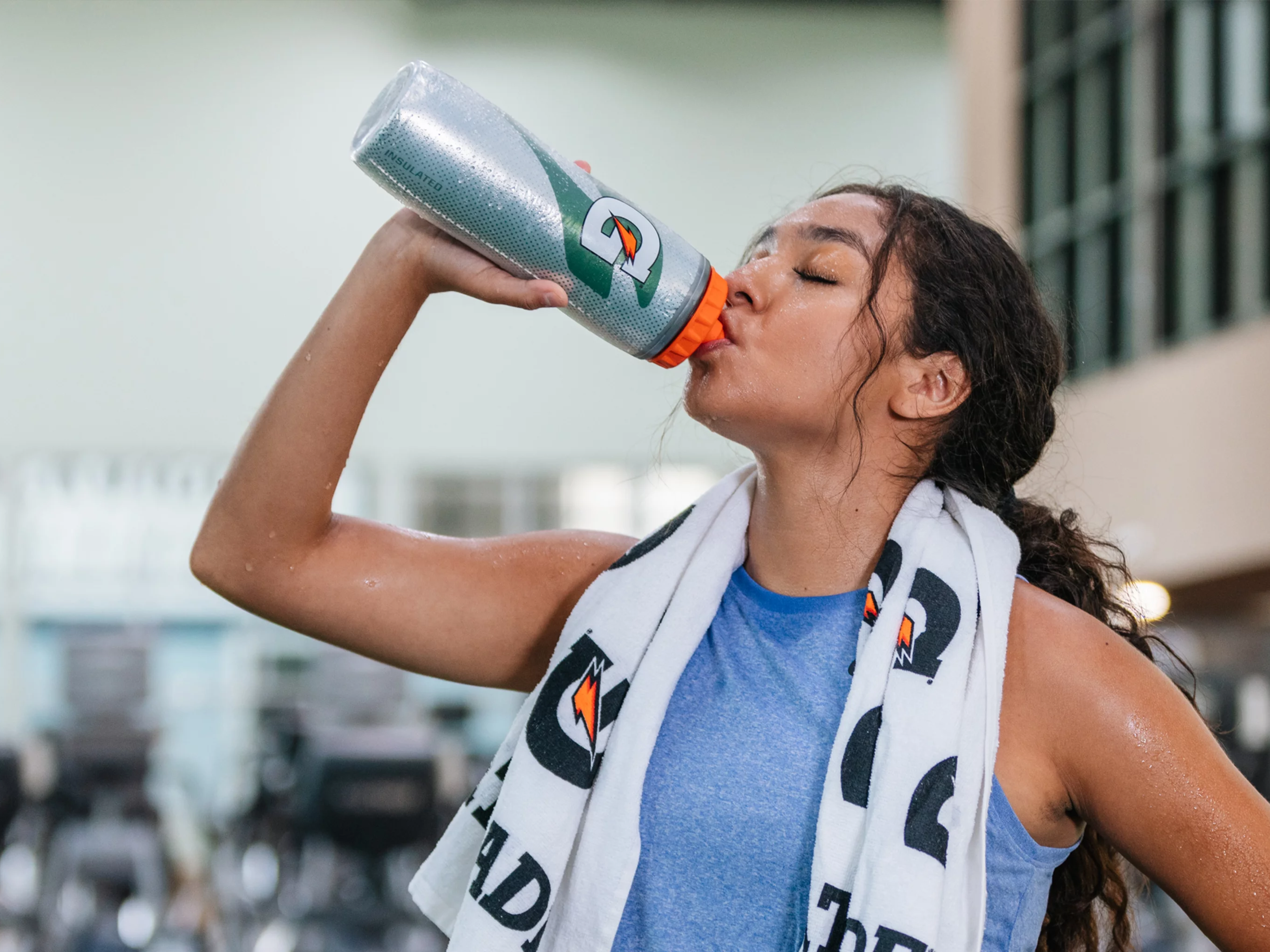 Athlete drinking from Gx bottle