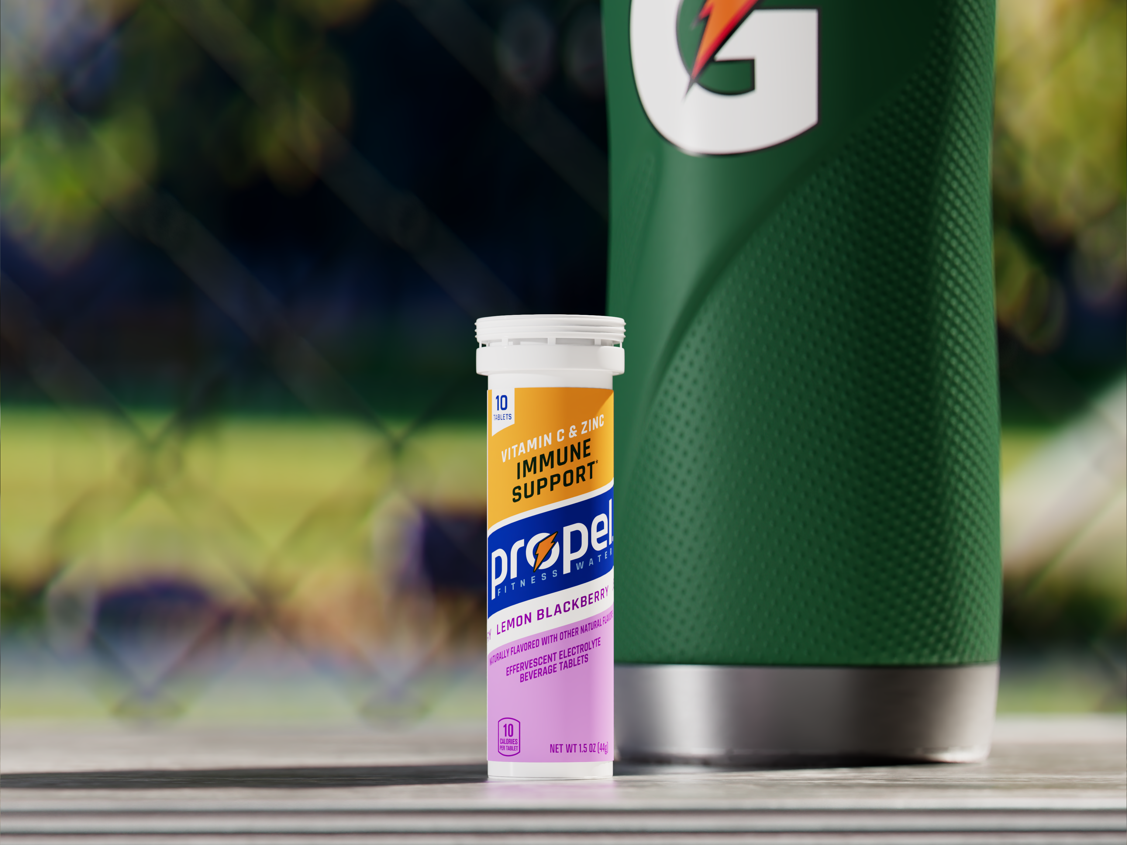 Propel Immunity Support Tablets Lemon Blackberry next to a Gatorade bottle