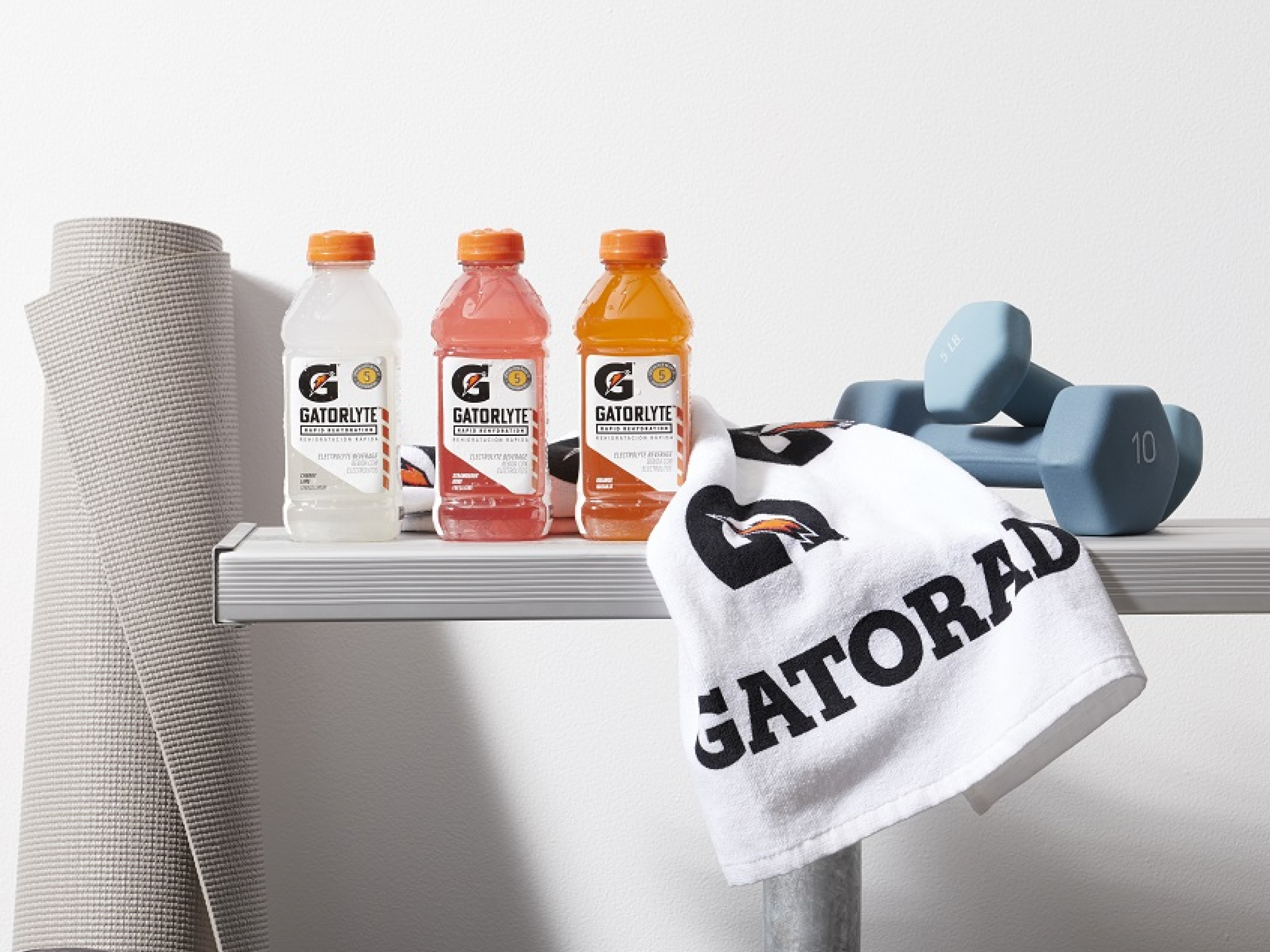 Three bottles of Gatorlyte ready to drink with Gx towel