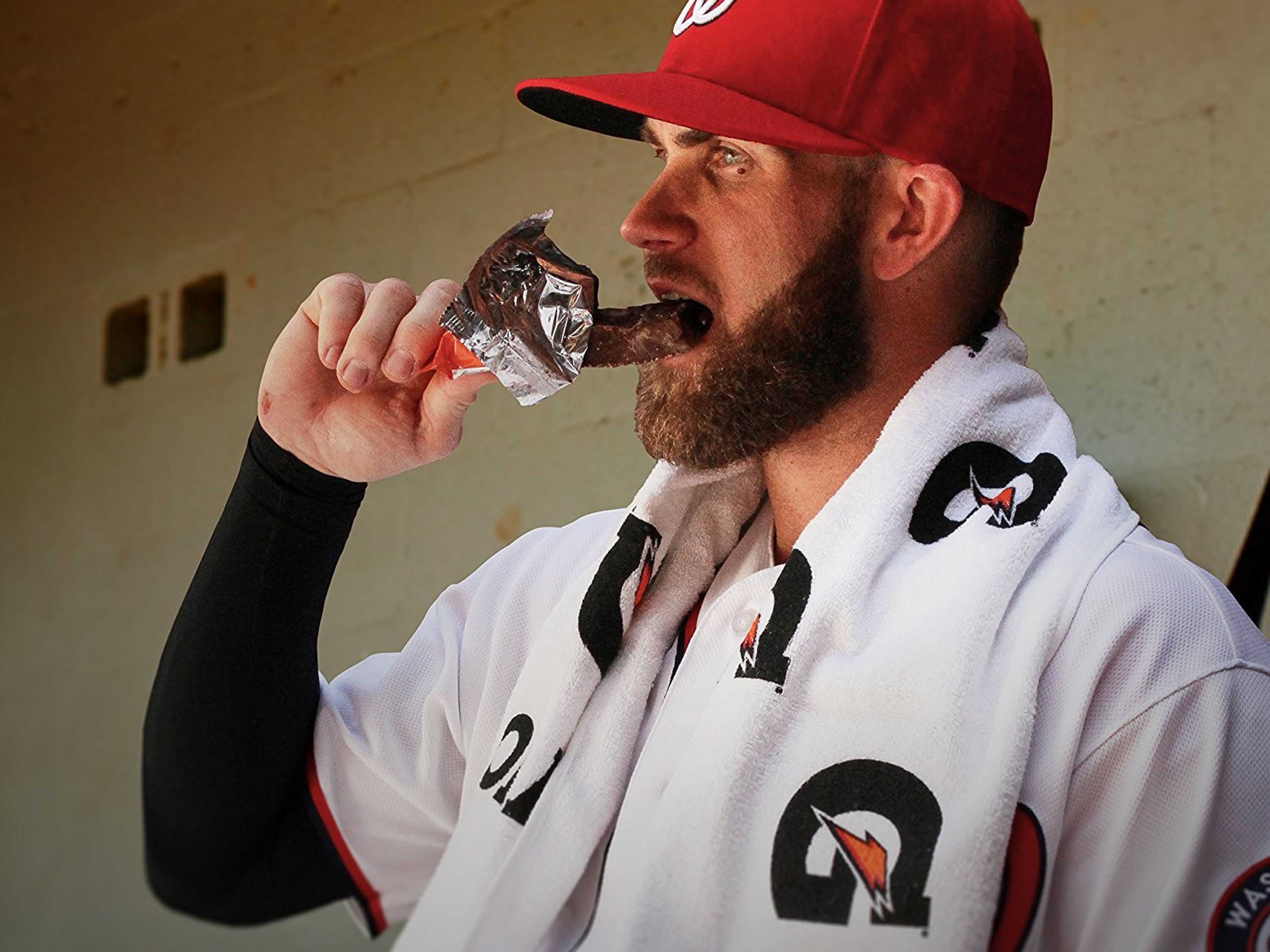 Bryce Harper eating a protein bar