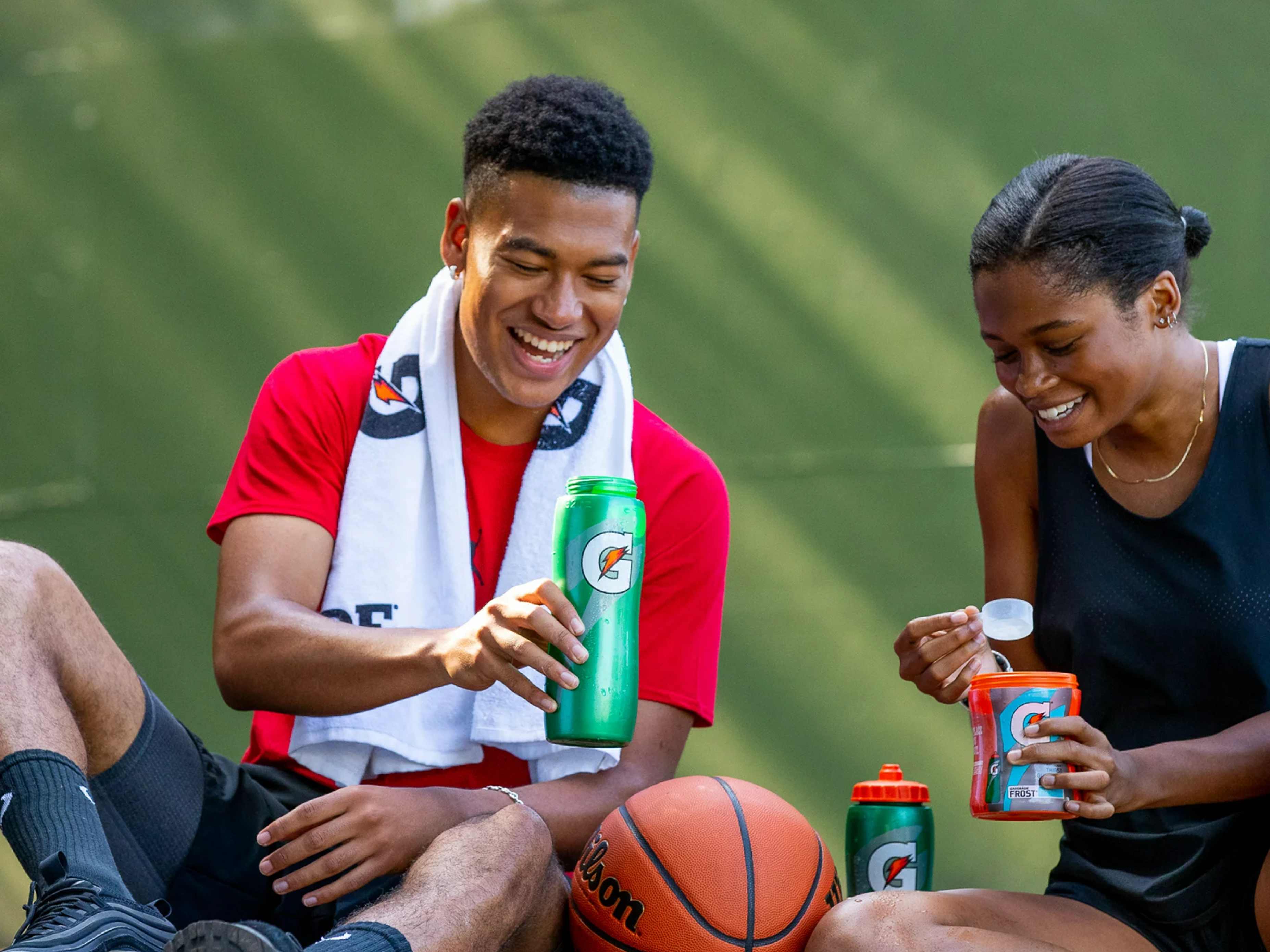 Athletes using Gatorskin bottles