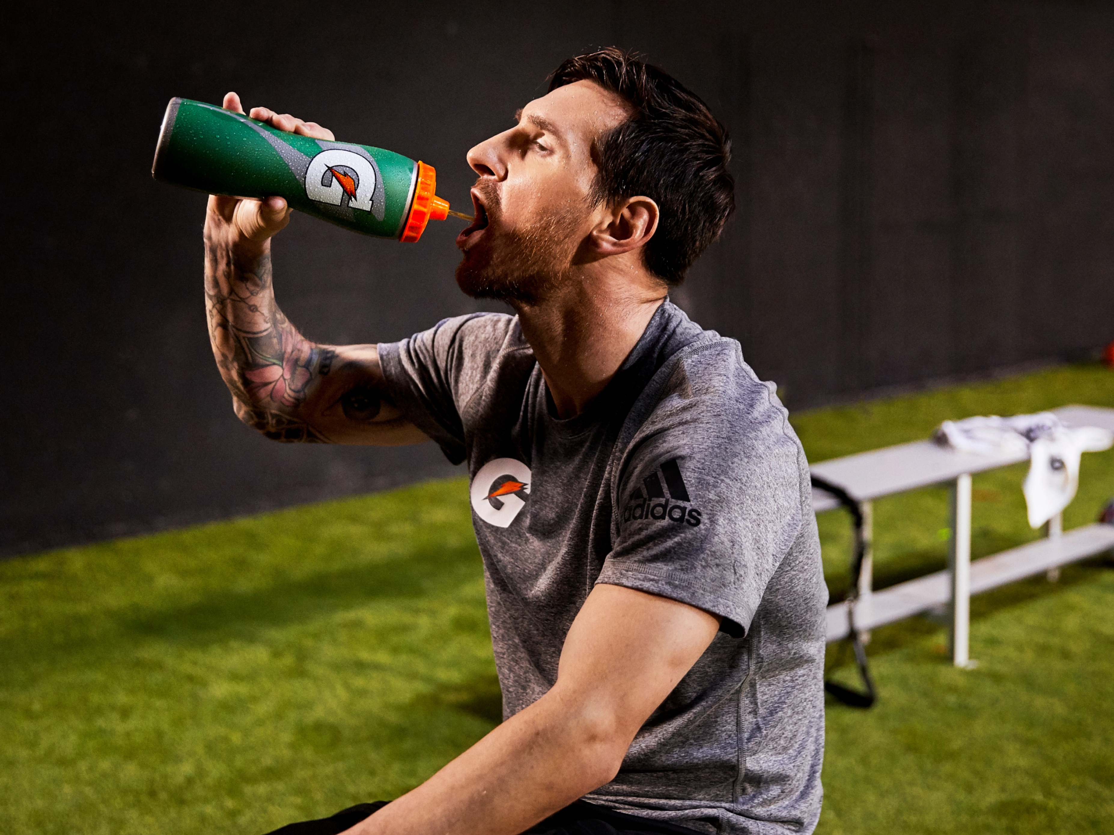 Lionel Messi drinking out of Gatorskin bottle