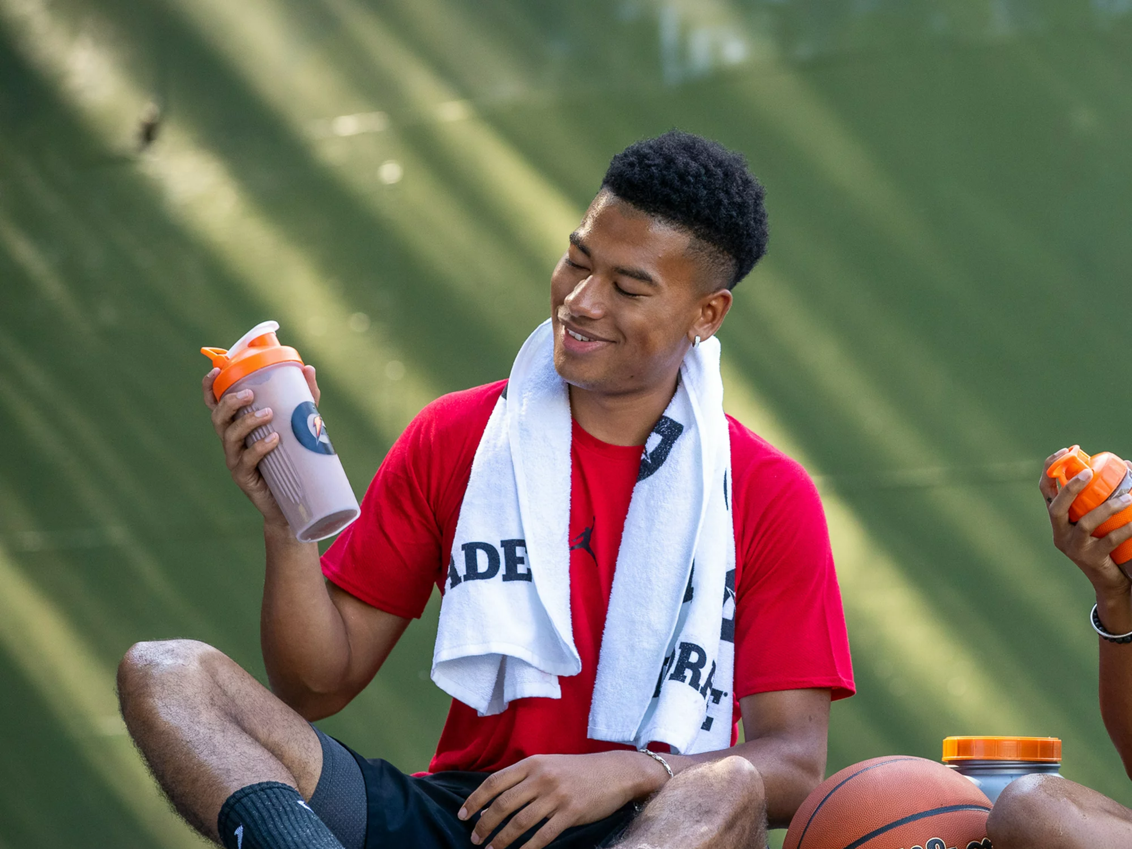 Athlete using transparent shaker bottle