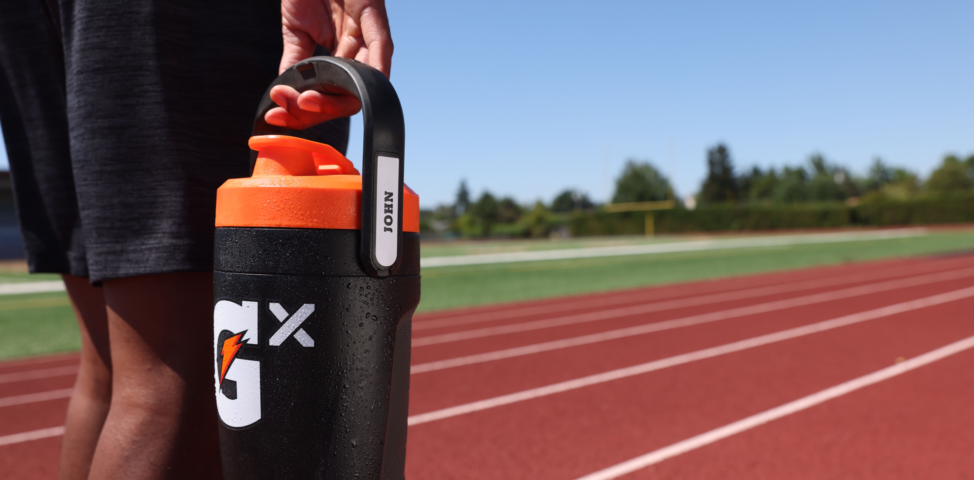 Athlete holding black Gx jug