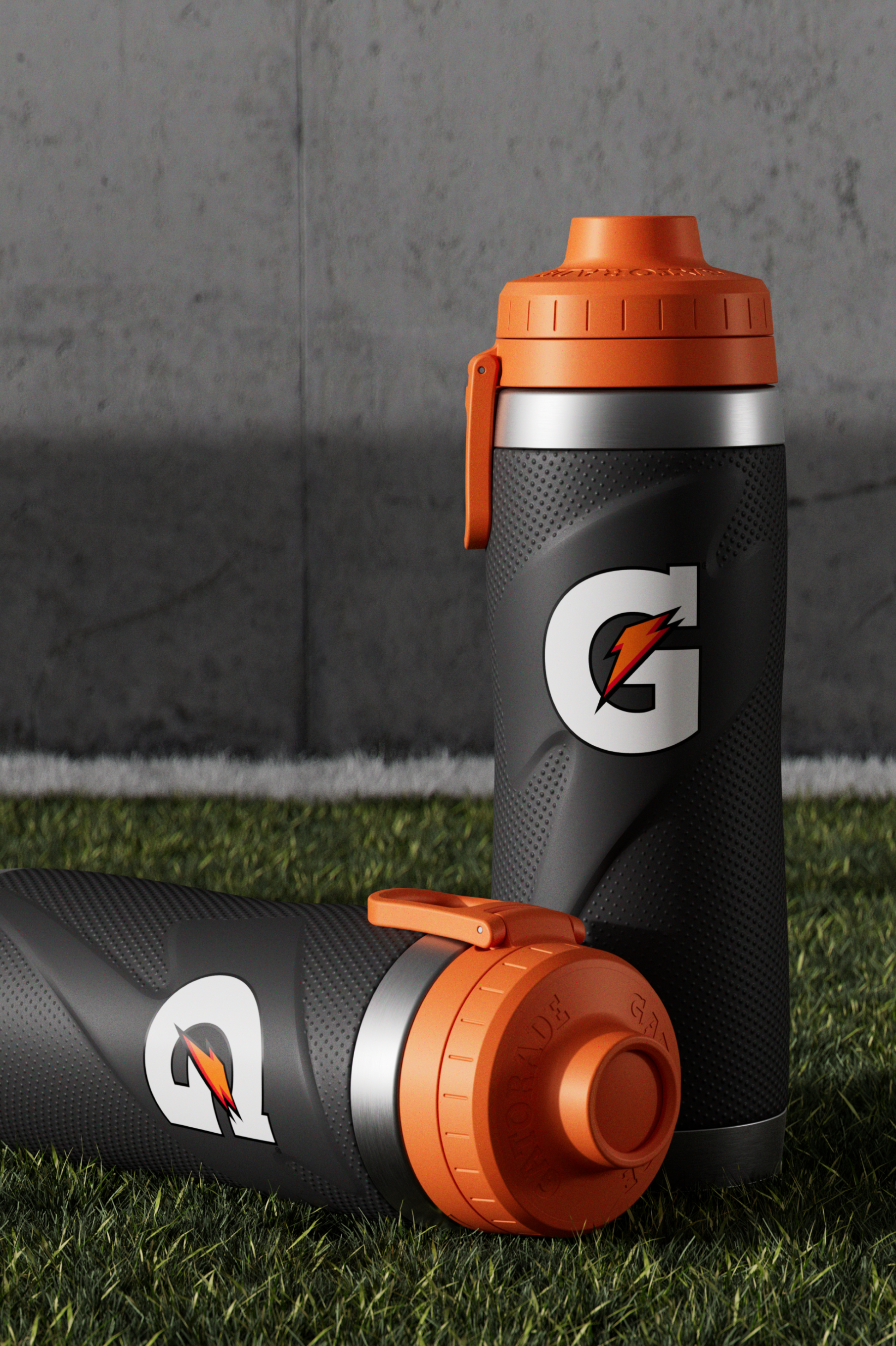 Black stainless steel bottles on turf