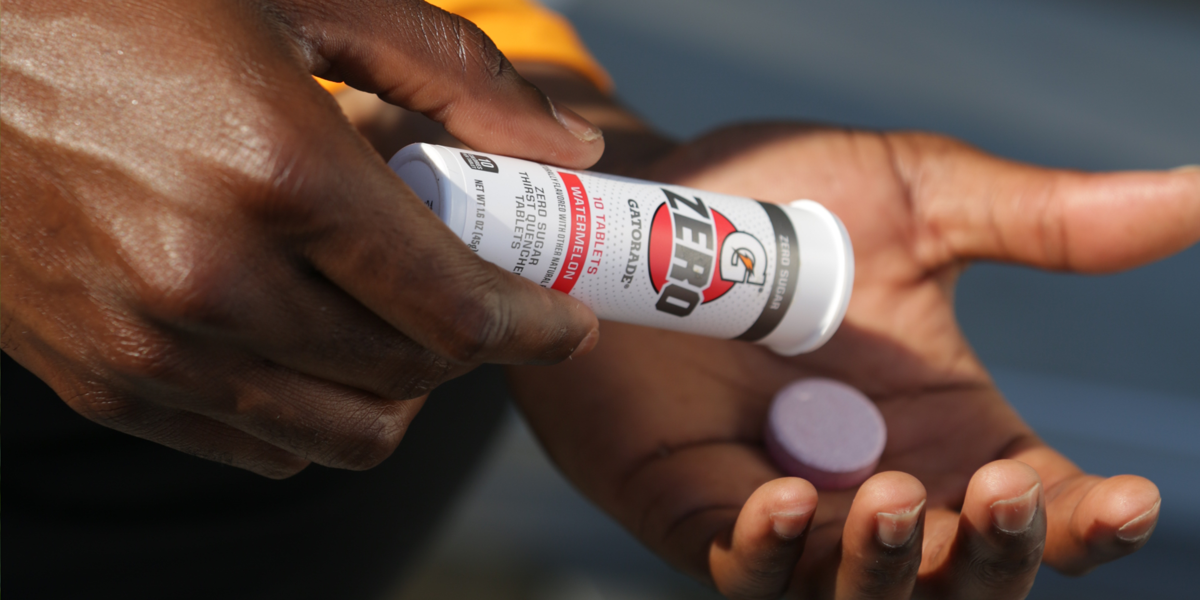 Gatorade Zero tablets in athlete's hand