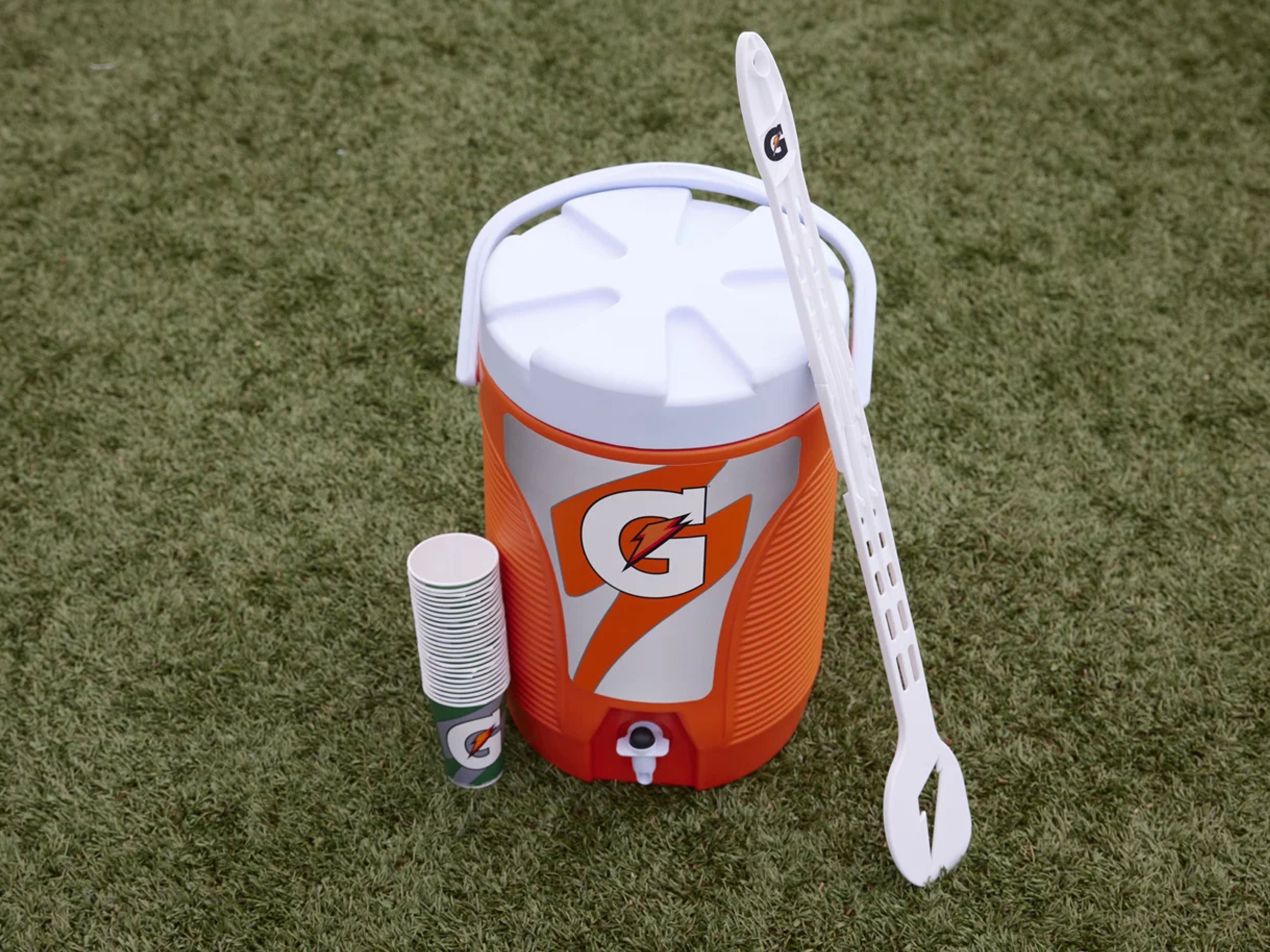 Mixing spoon next to a Gatorade cooler