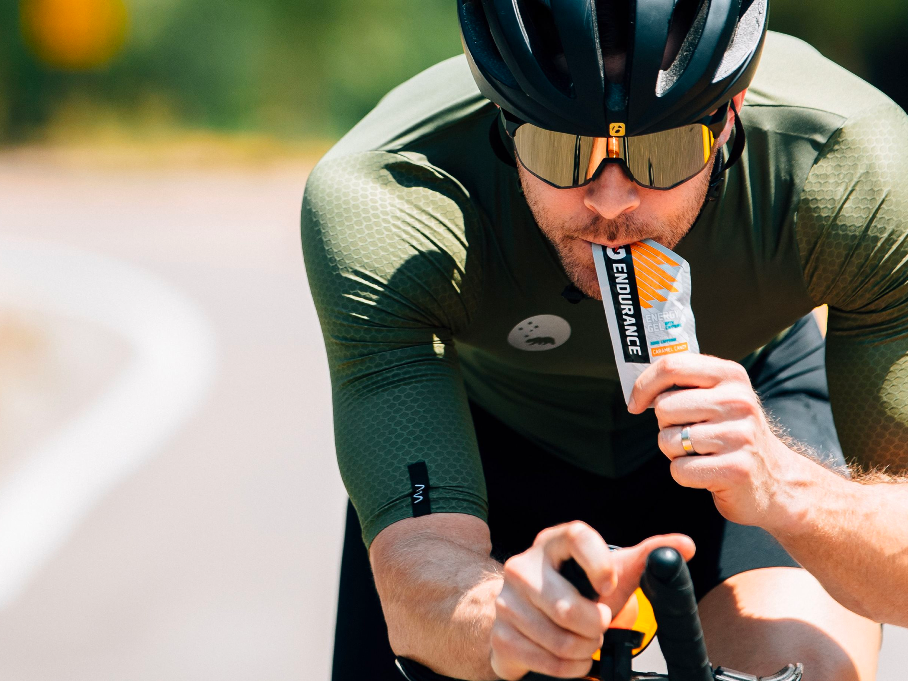 Athlete with endurance energy gel with caffeine caramel candy