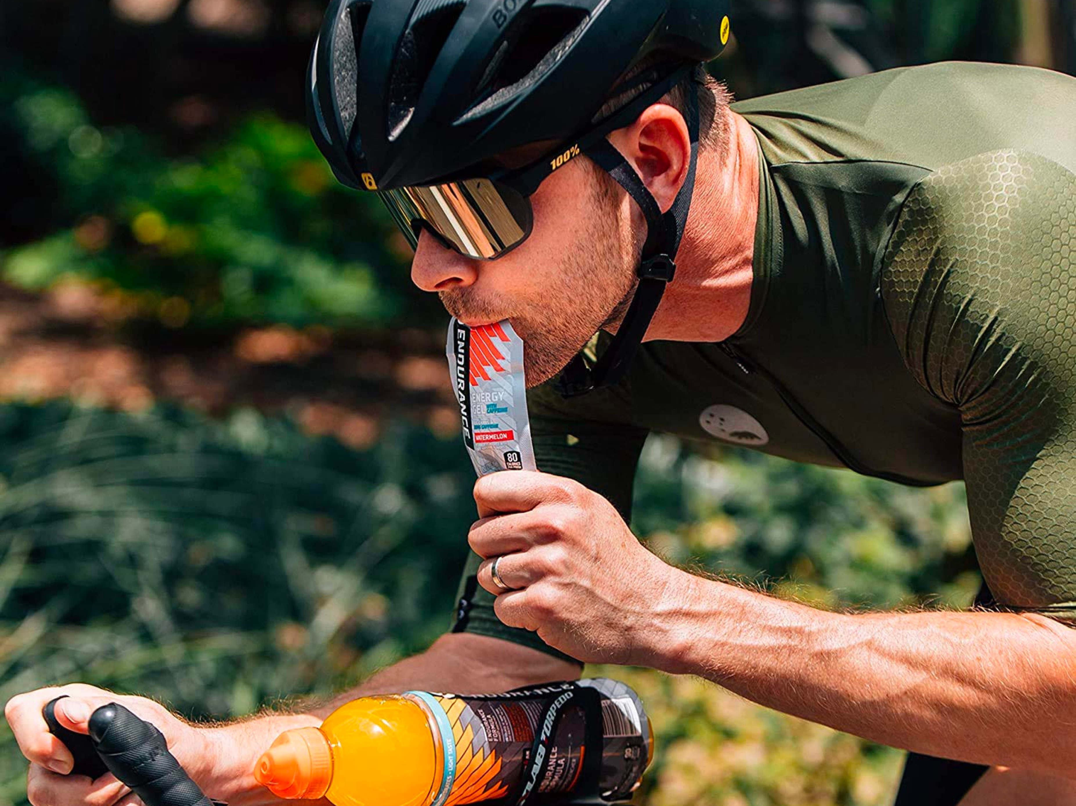 Athlete with endurance energy gel with caffeine strawberry