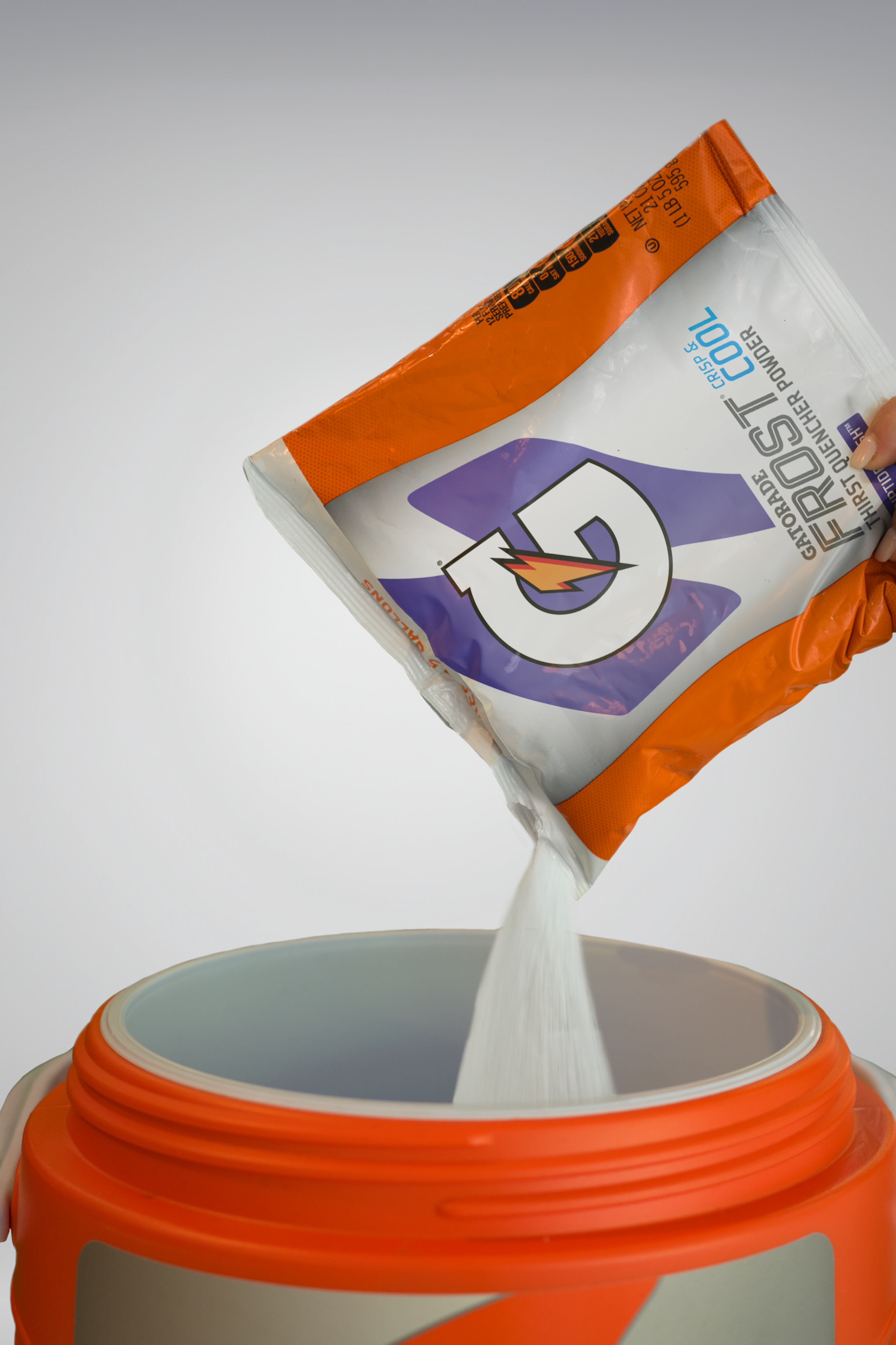 Gatorade thirst quencher riptide rush 2.5 gallon bag riptide rush being poured into cooler