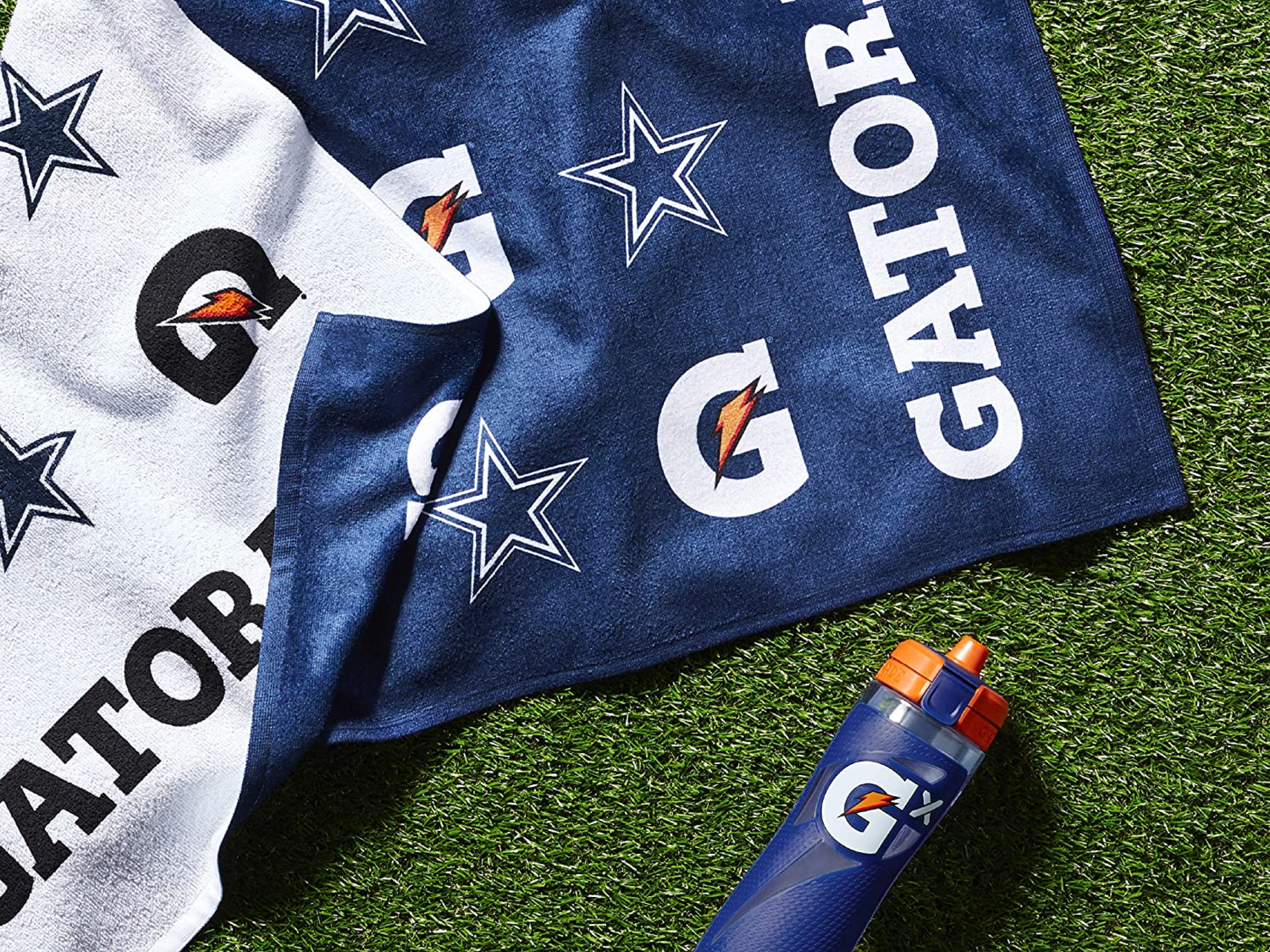 Dallas Cowboys Towel on Turf with a Gx Bottle