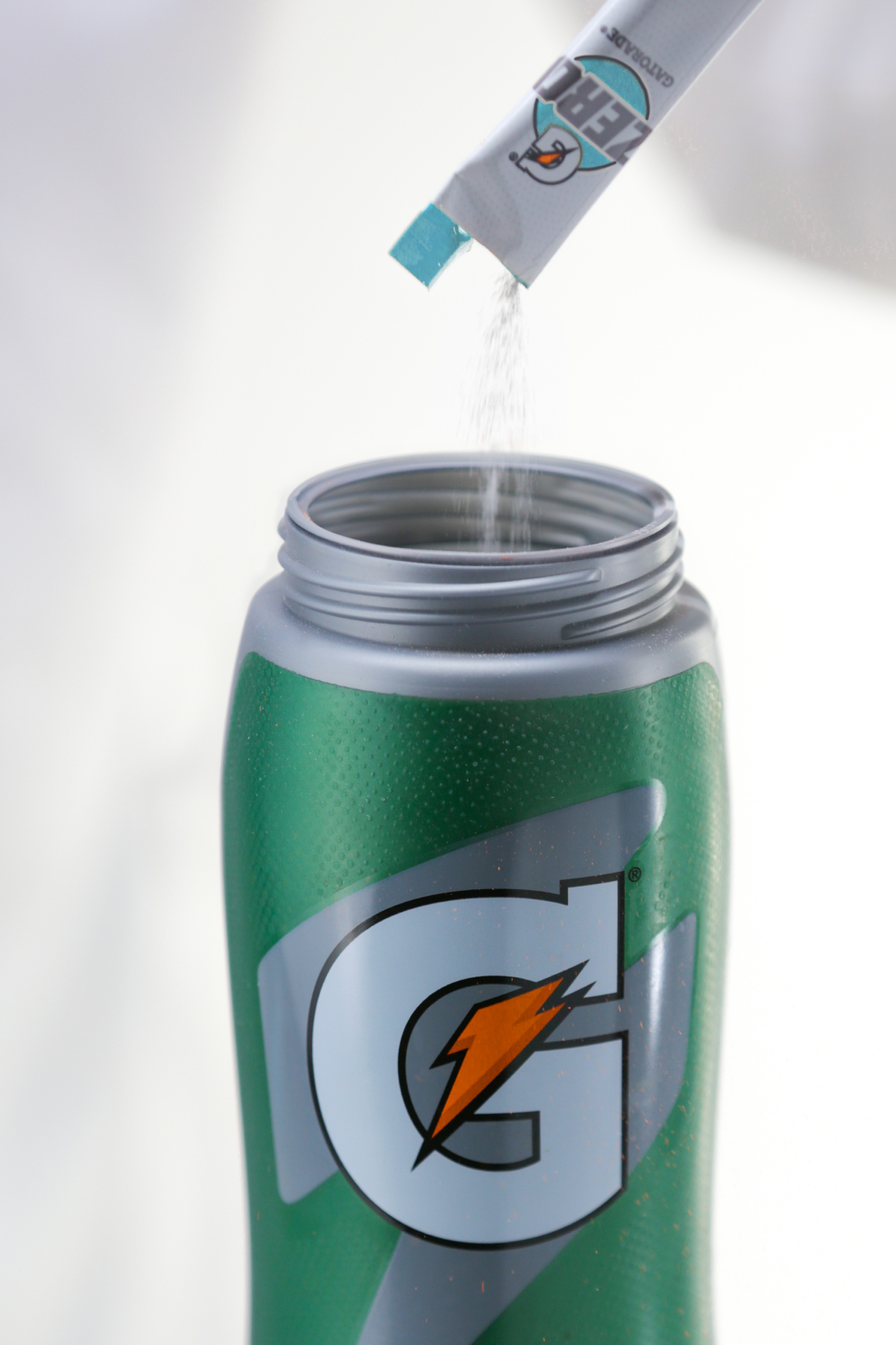 Pouring Gatorade Zero Powder Glacier Freeze into a Gatorade bottle