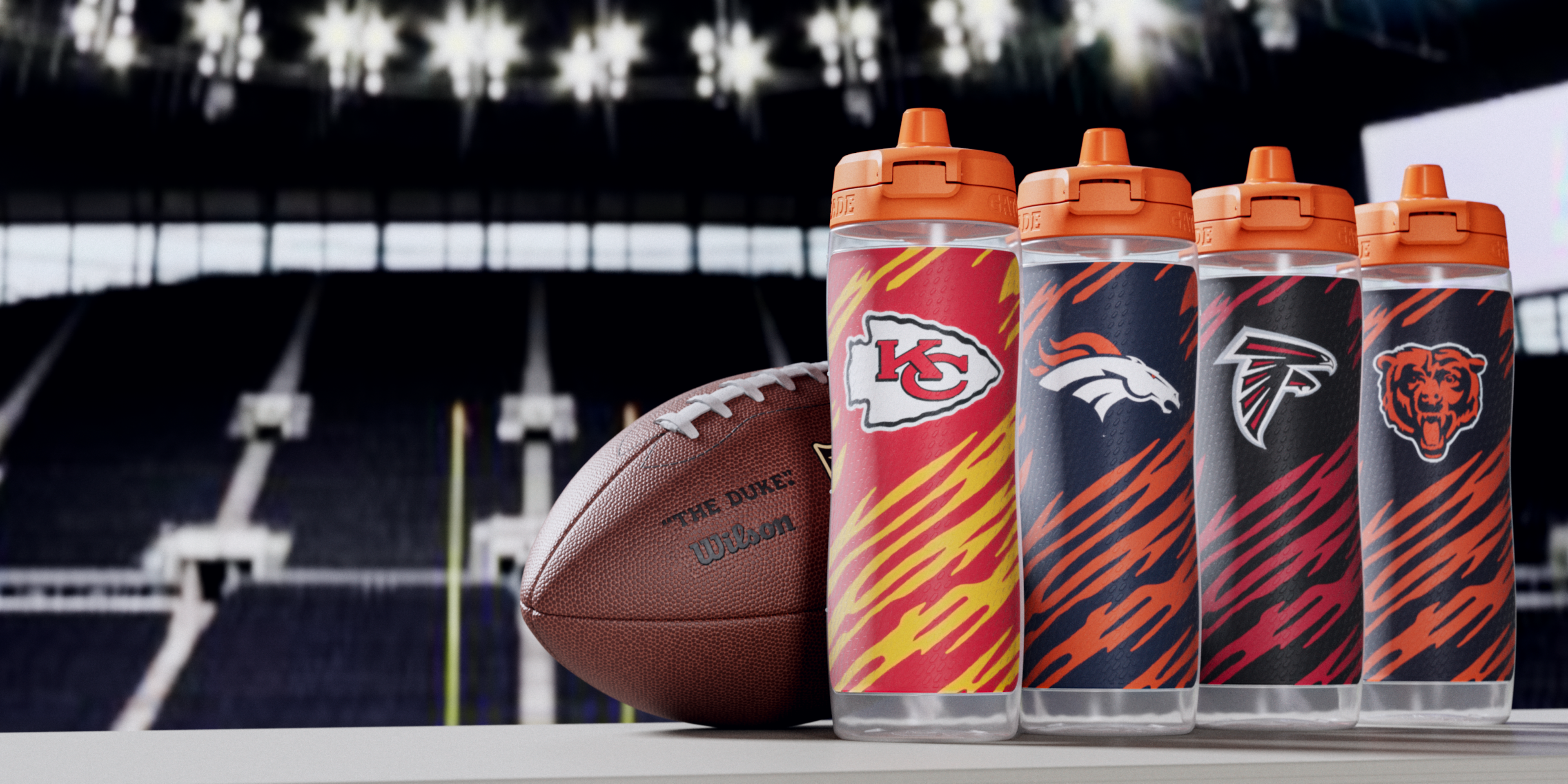 Gx NFL Bottles with team logos next to a football