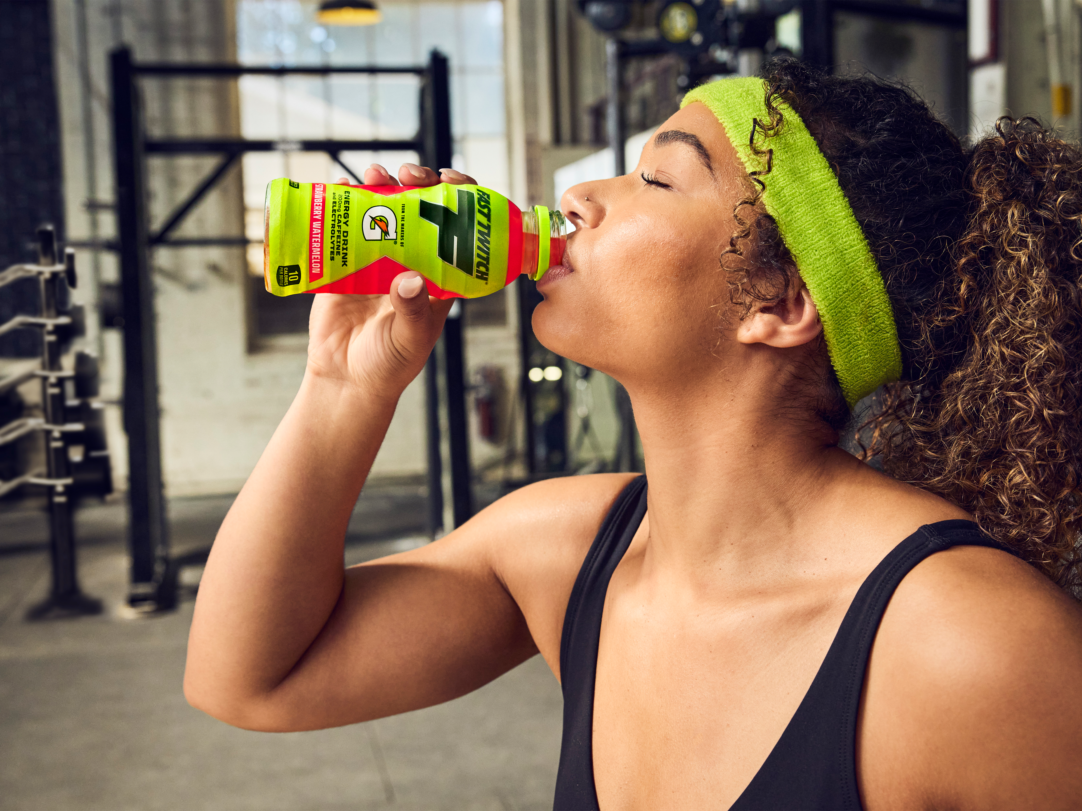 Athlete in gym drinking Fast Twitch Ready to drink Strawberry Watermelon