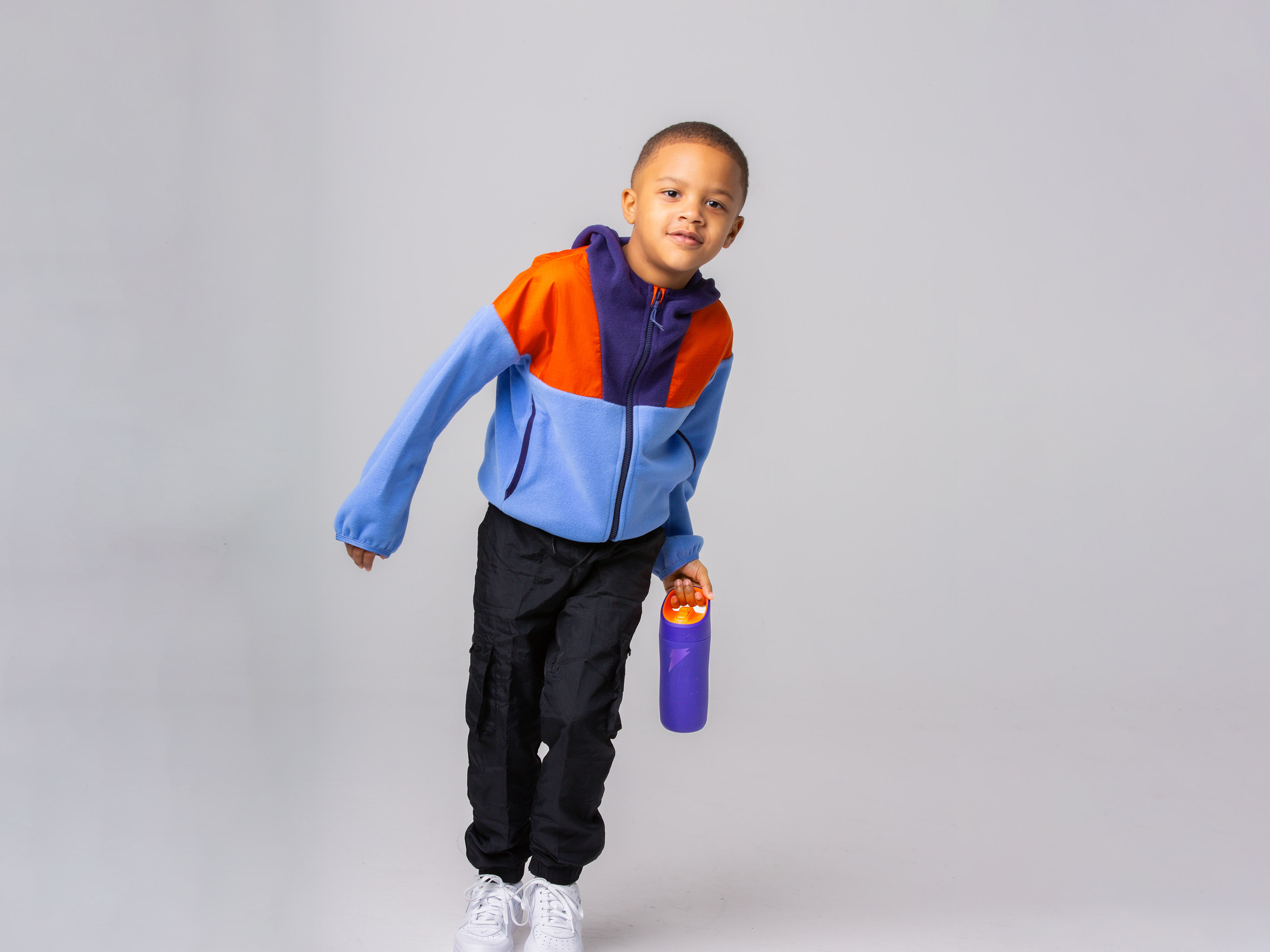 Young athlete with rookie bottle in purple