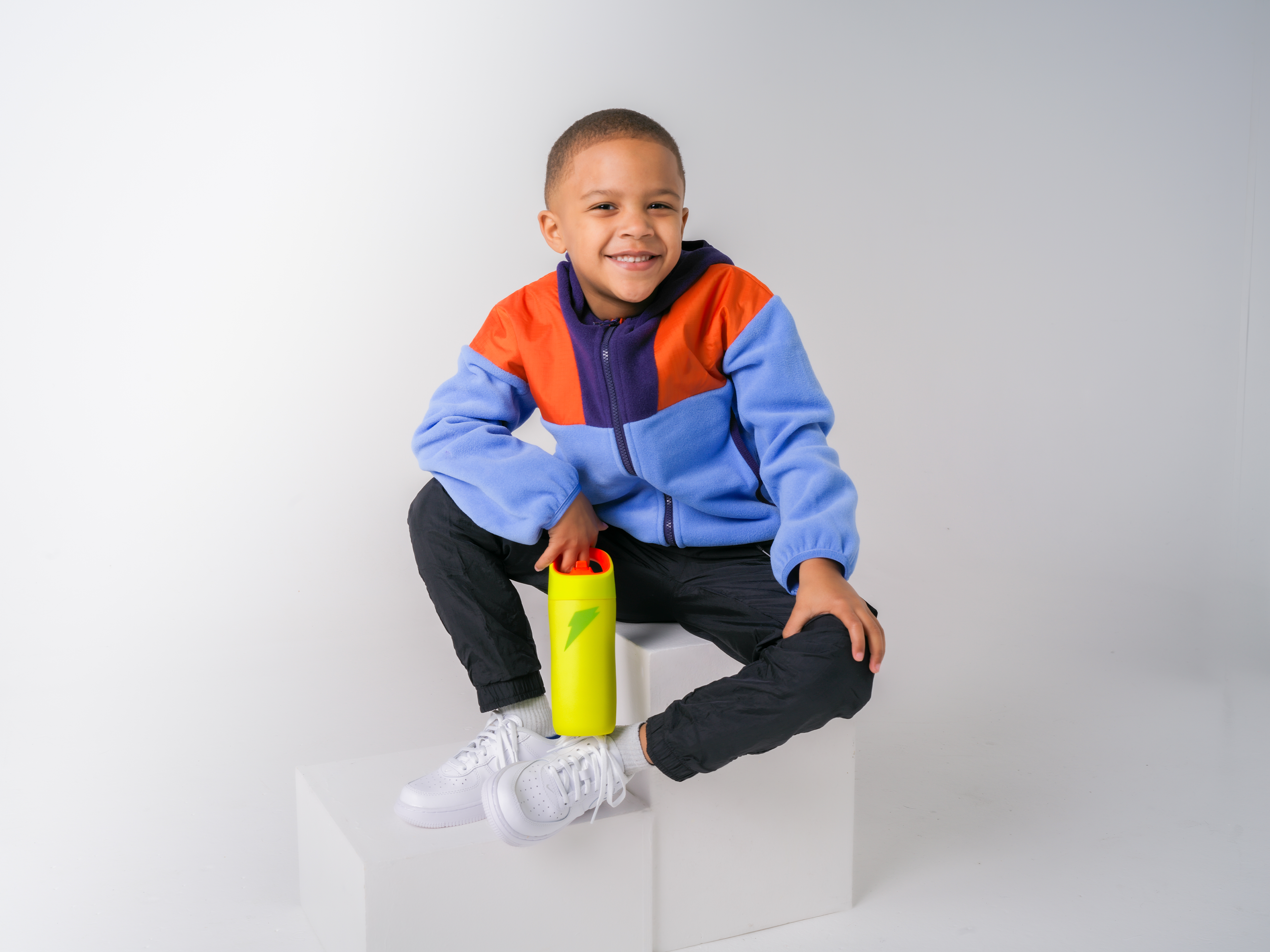 Young athlete with rookie bottle in yellow