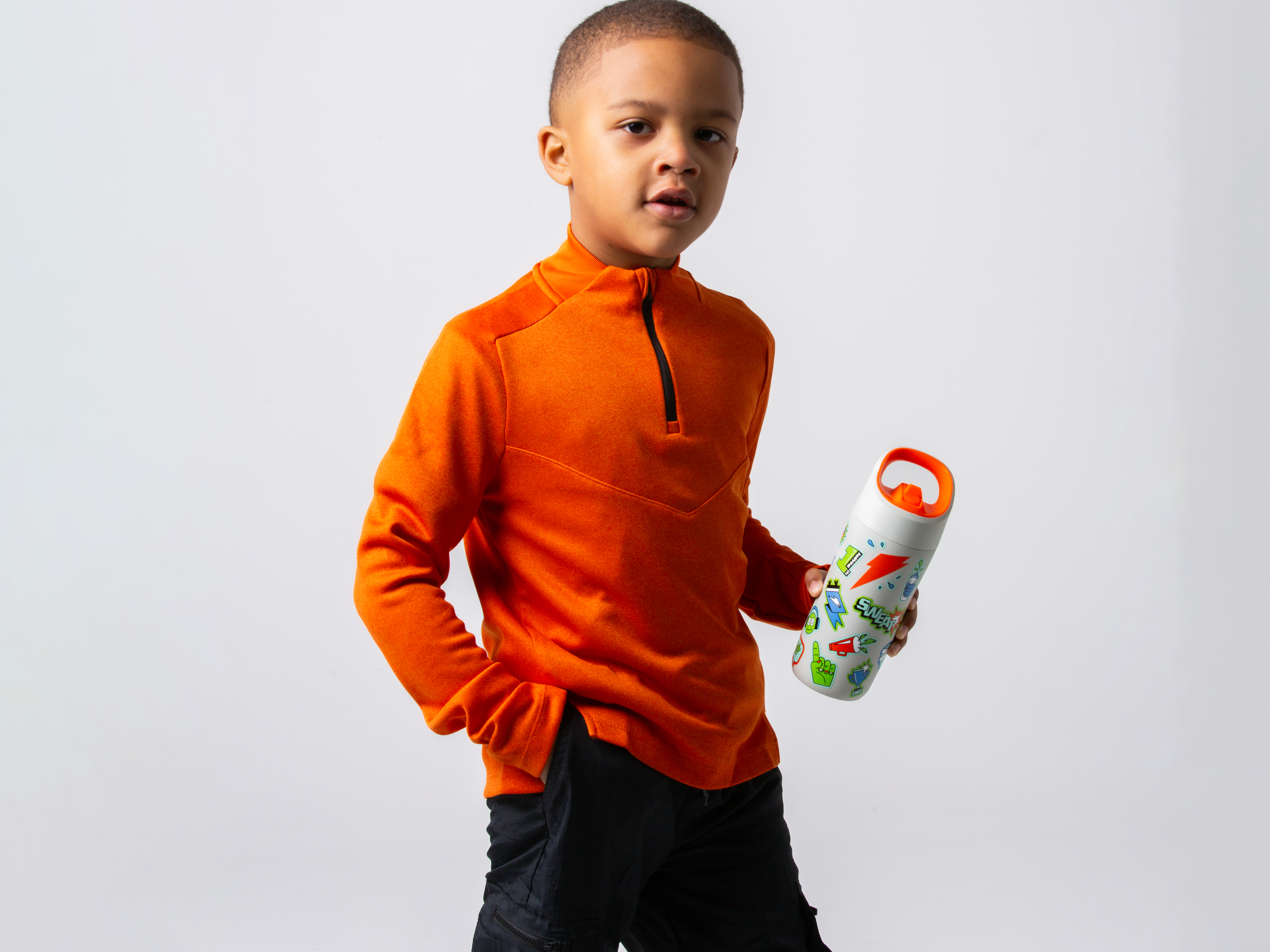 Young athlete with rookie bottle in white with stickers