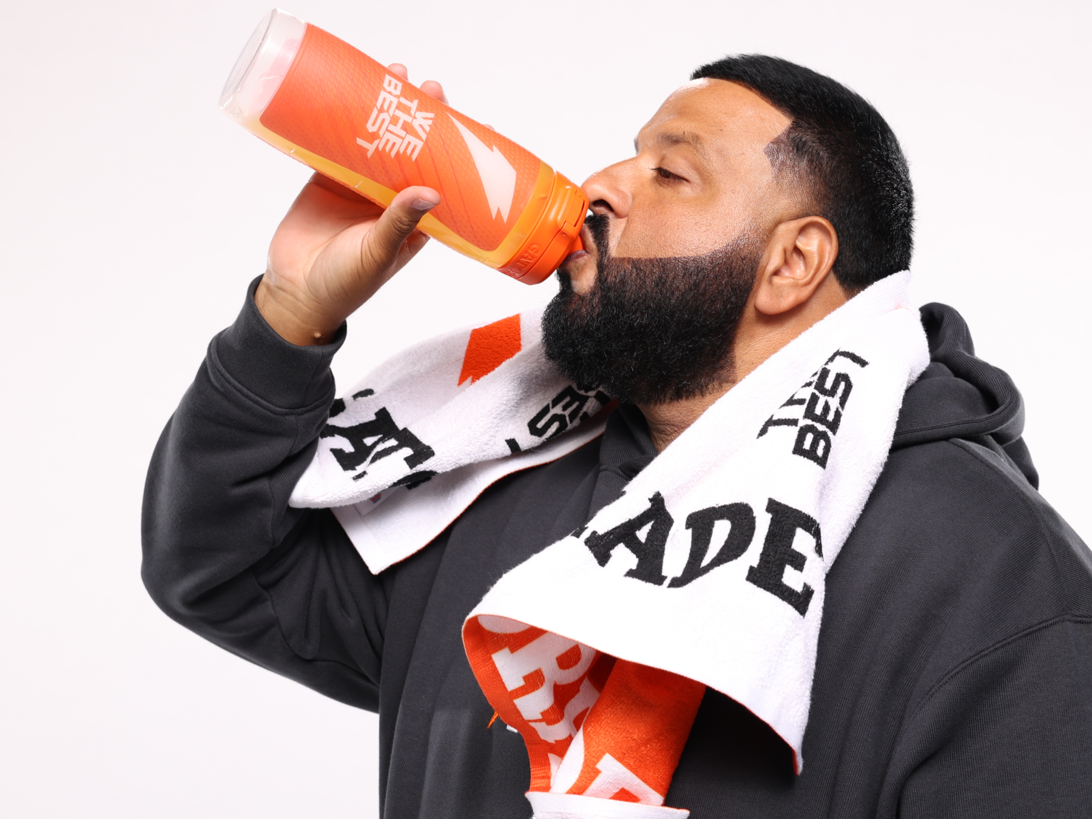 DJ Khaled drinking from "We the best" collaboration bottle