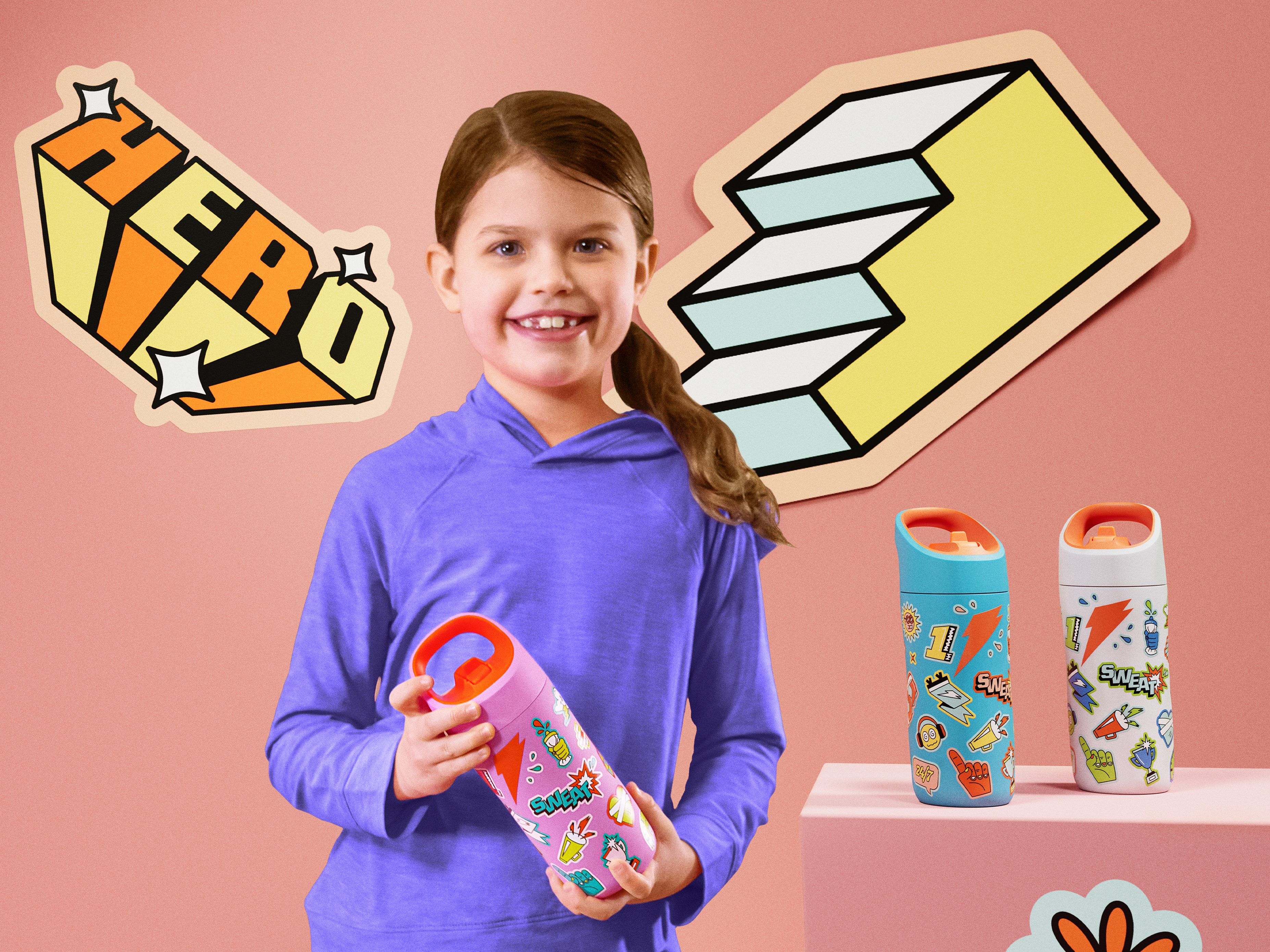 Kid holding Rookie bottle in Sticker Pink with other Sticker bottles on table