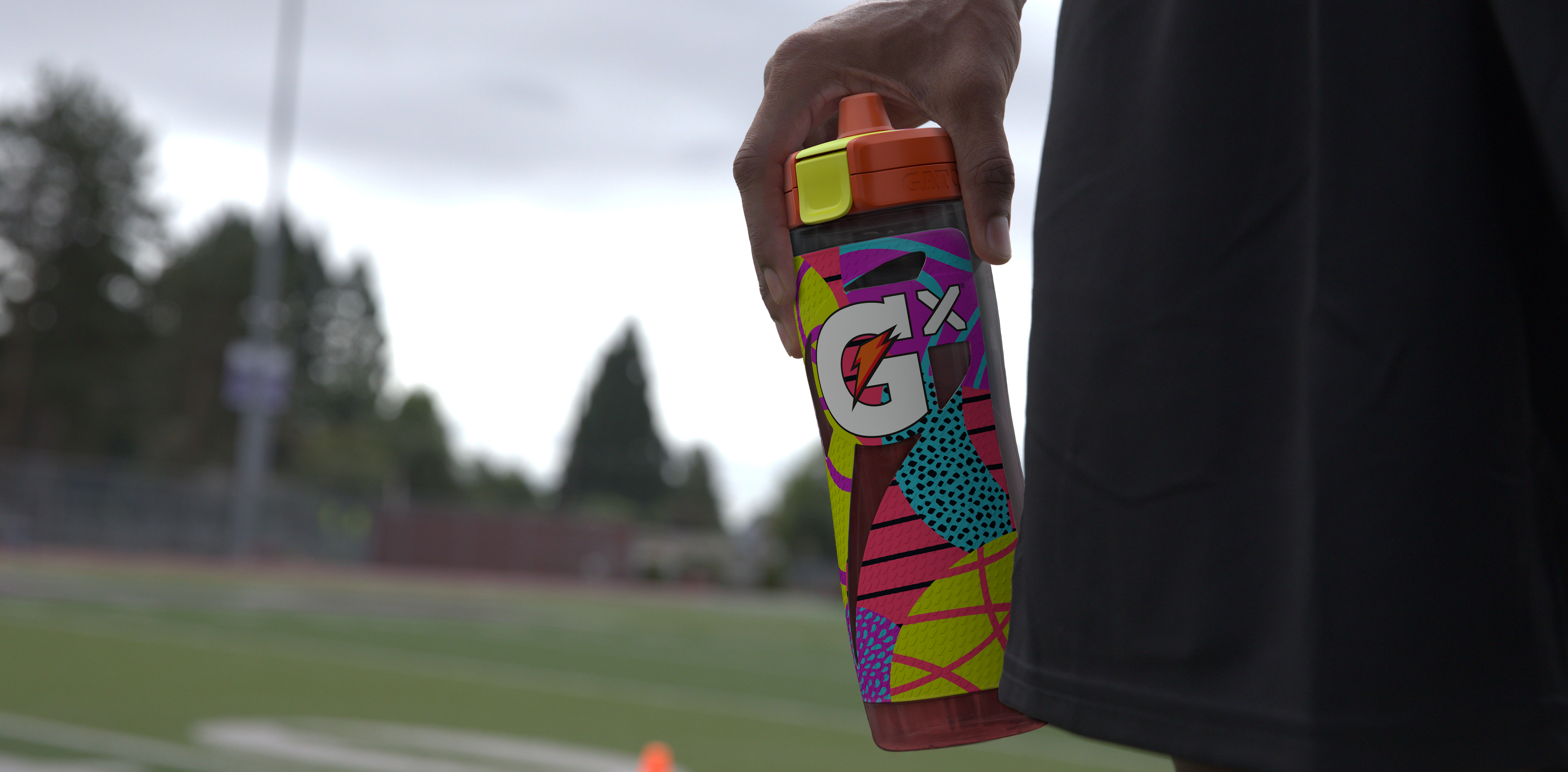 Athlete holding yellow montage bottle