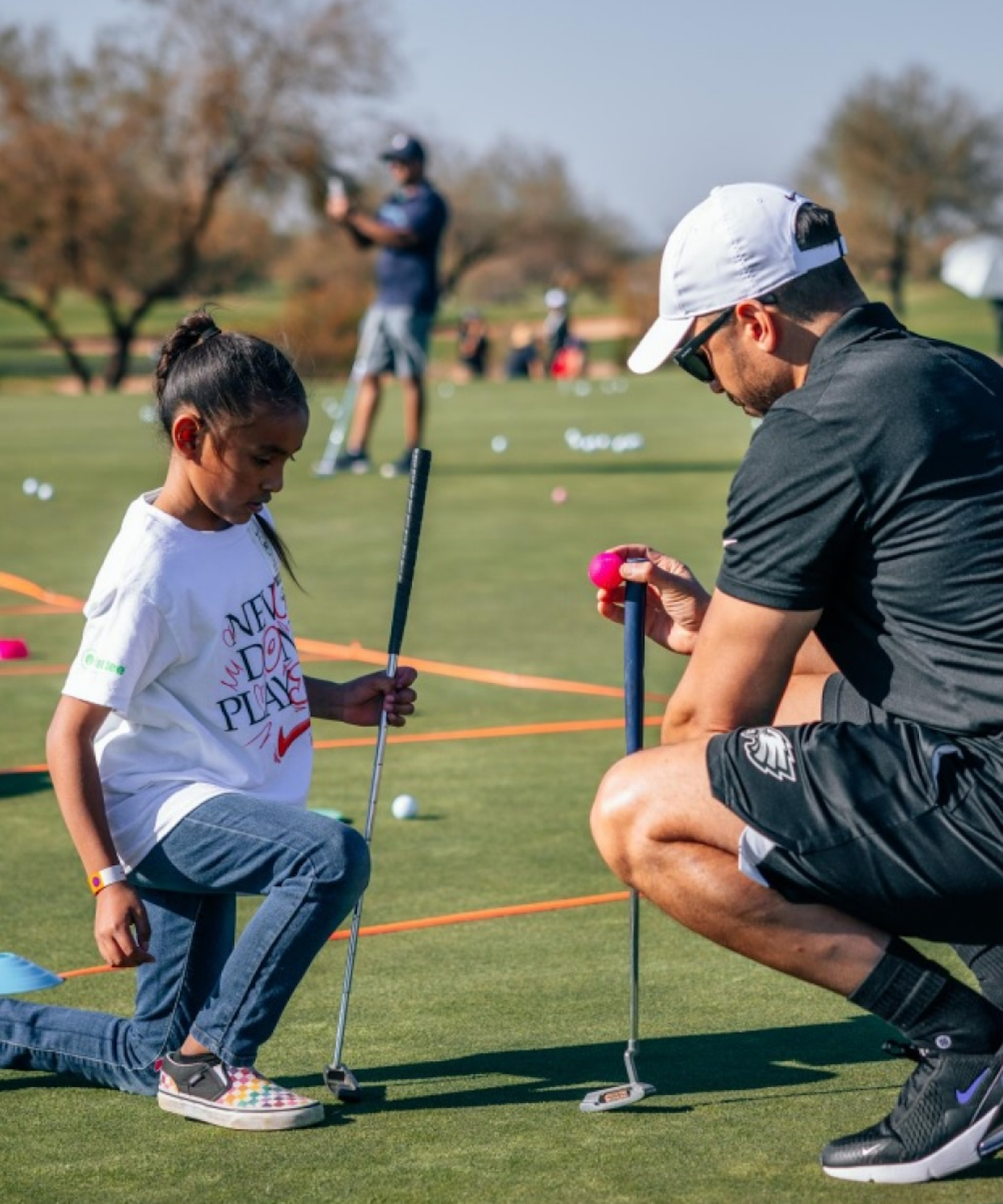 Young athletes playing golf