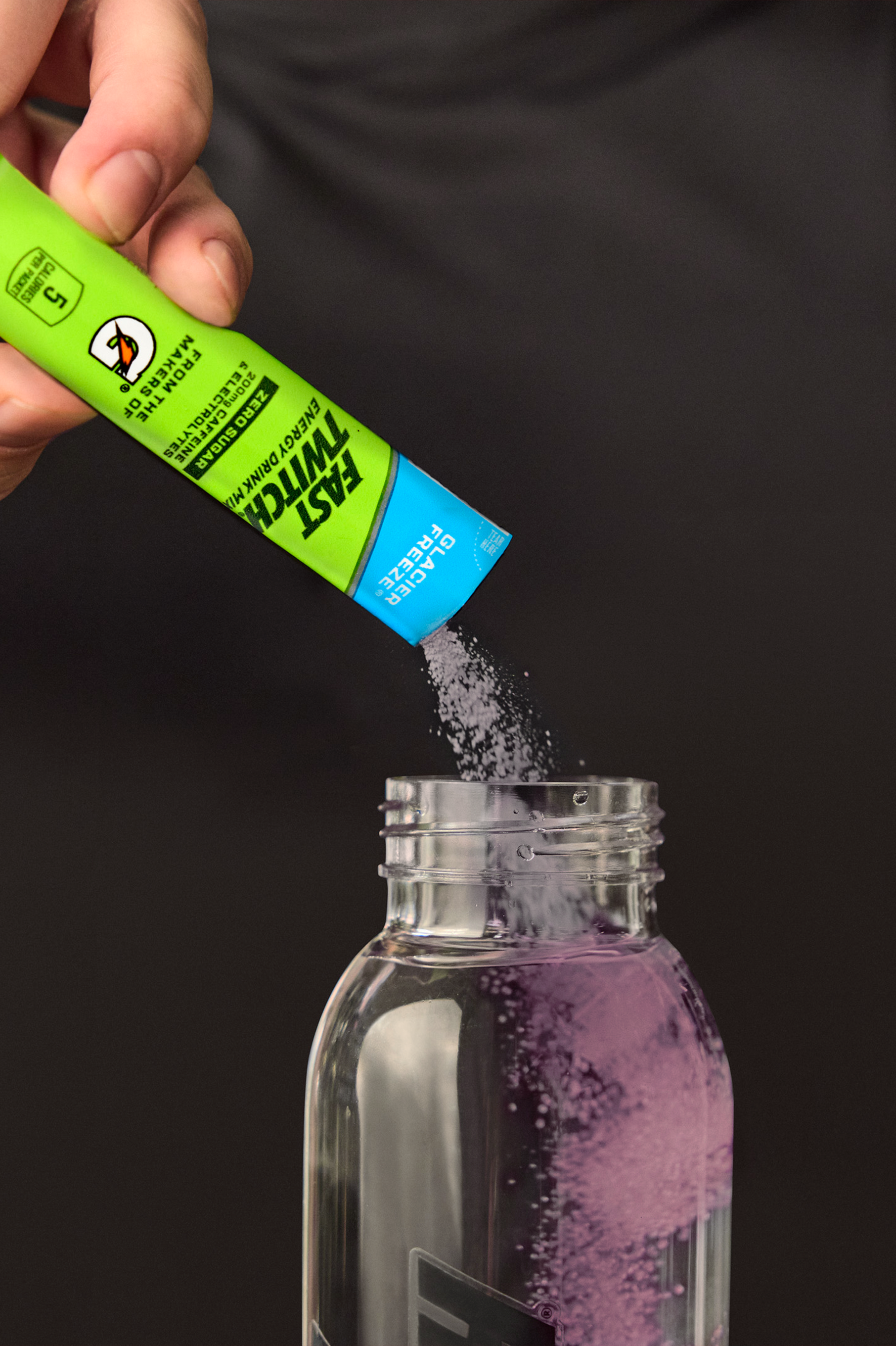 Fast Twitch Powder being poured into water bottle