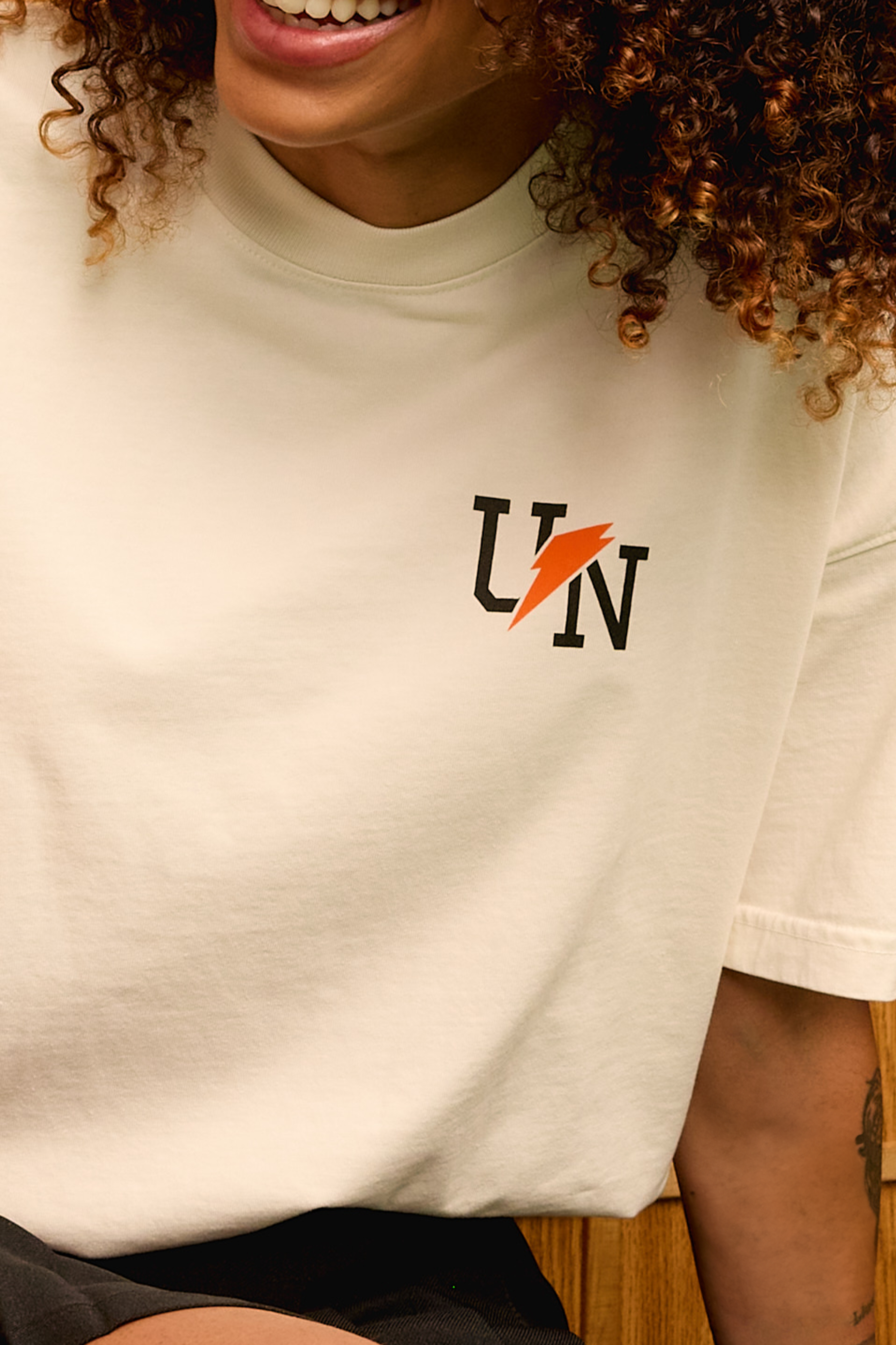 Woman wearing the Gatorade x UNINTERRUPTED T-Shirt