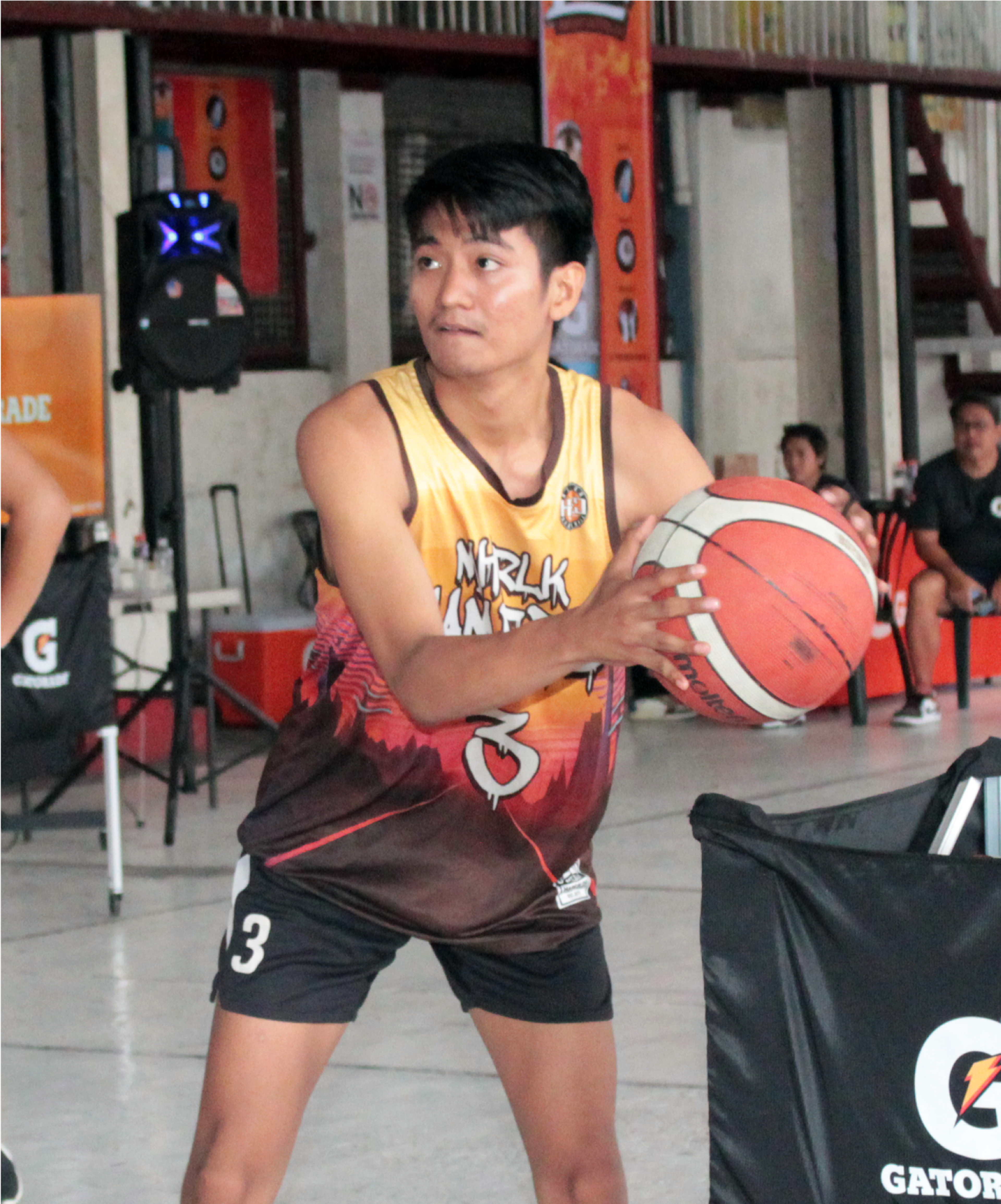Teenage boy playing basketball