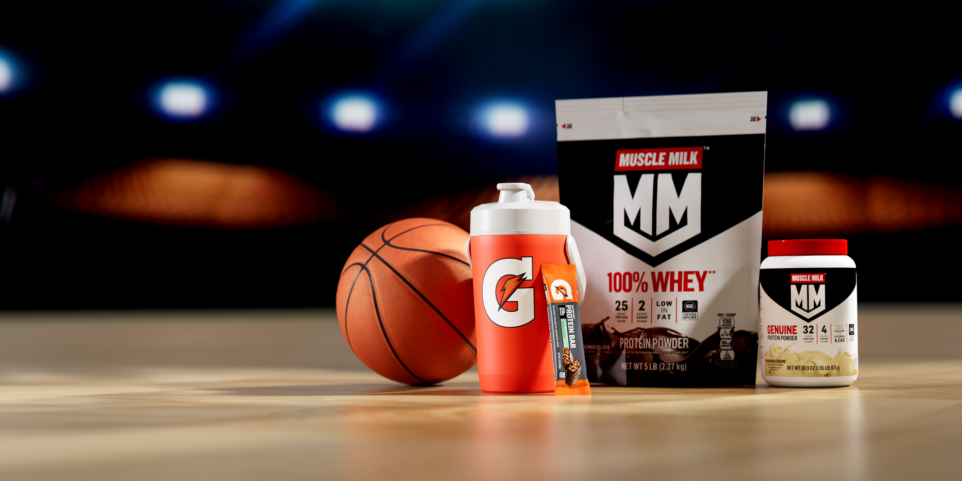 orange jug on a basketball court with protein muscle milk and protein bar IC