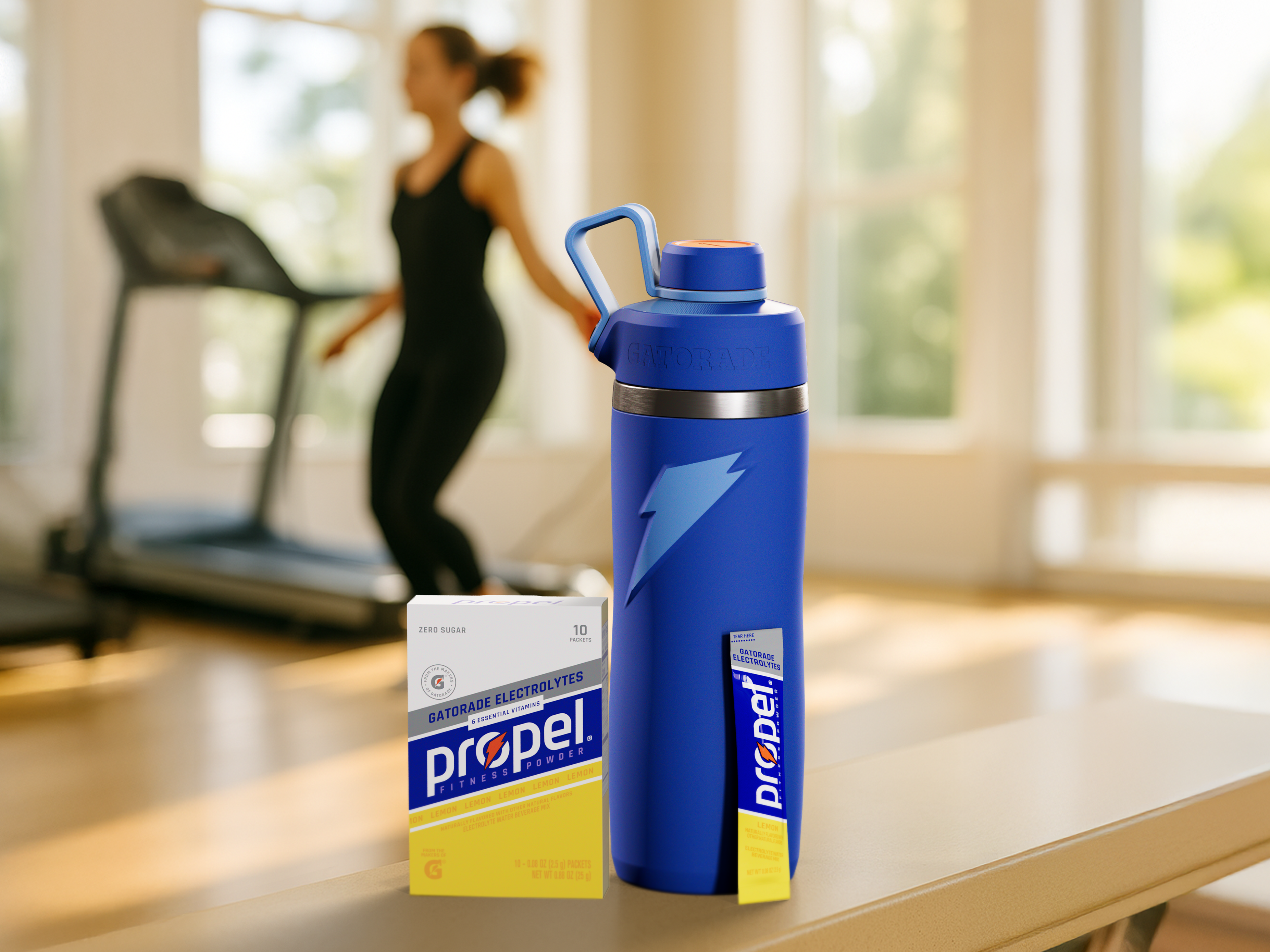 Propel lemon with overtime bottle in front of athlete