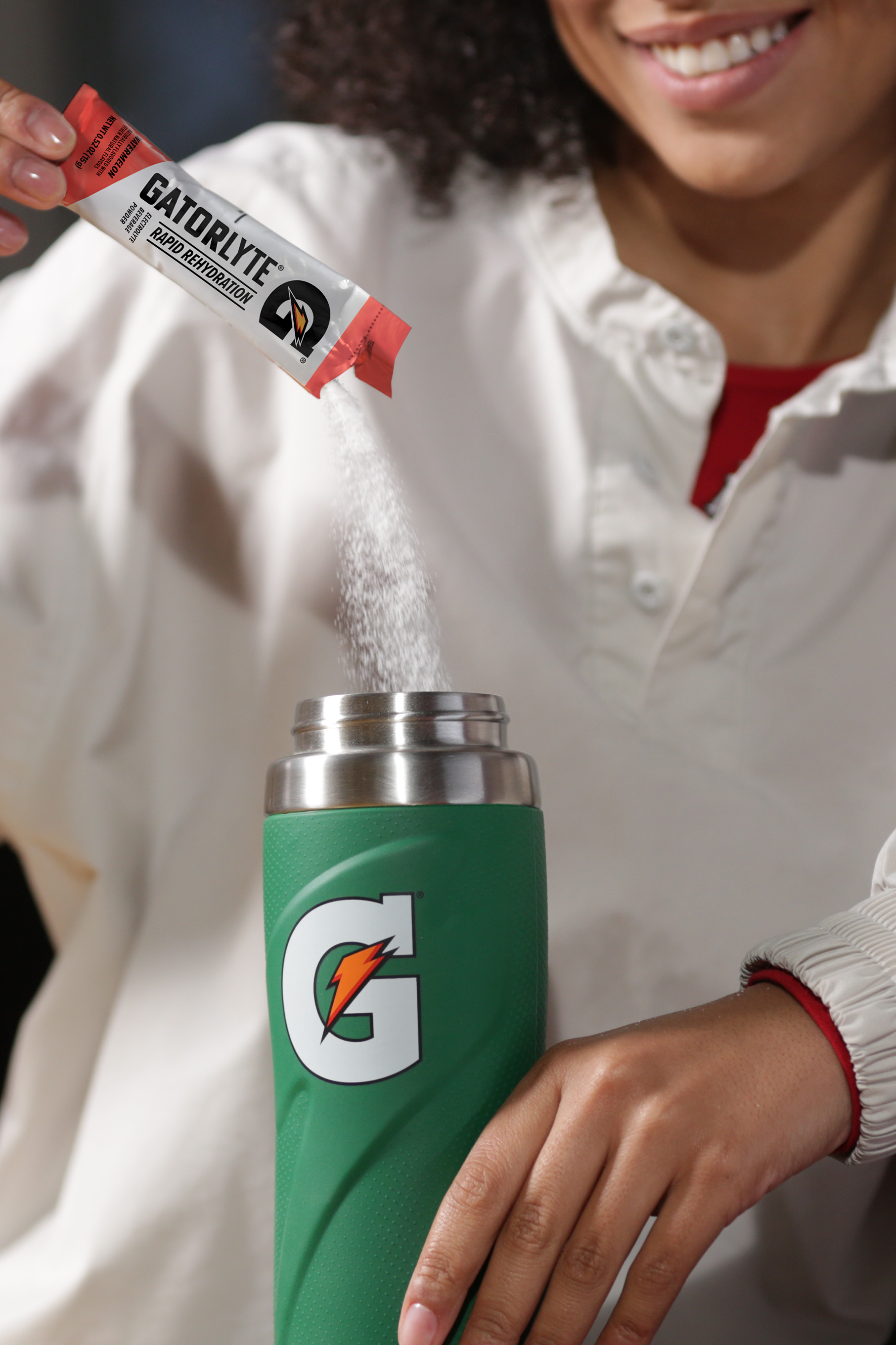 gatorlyte watermelon powder poured into g stainless bottle