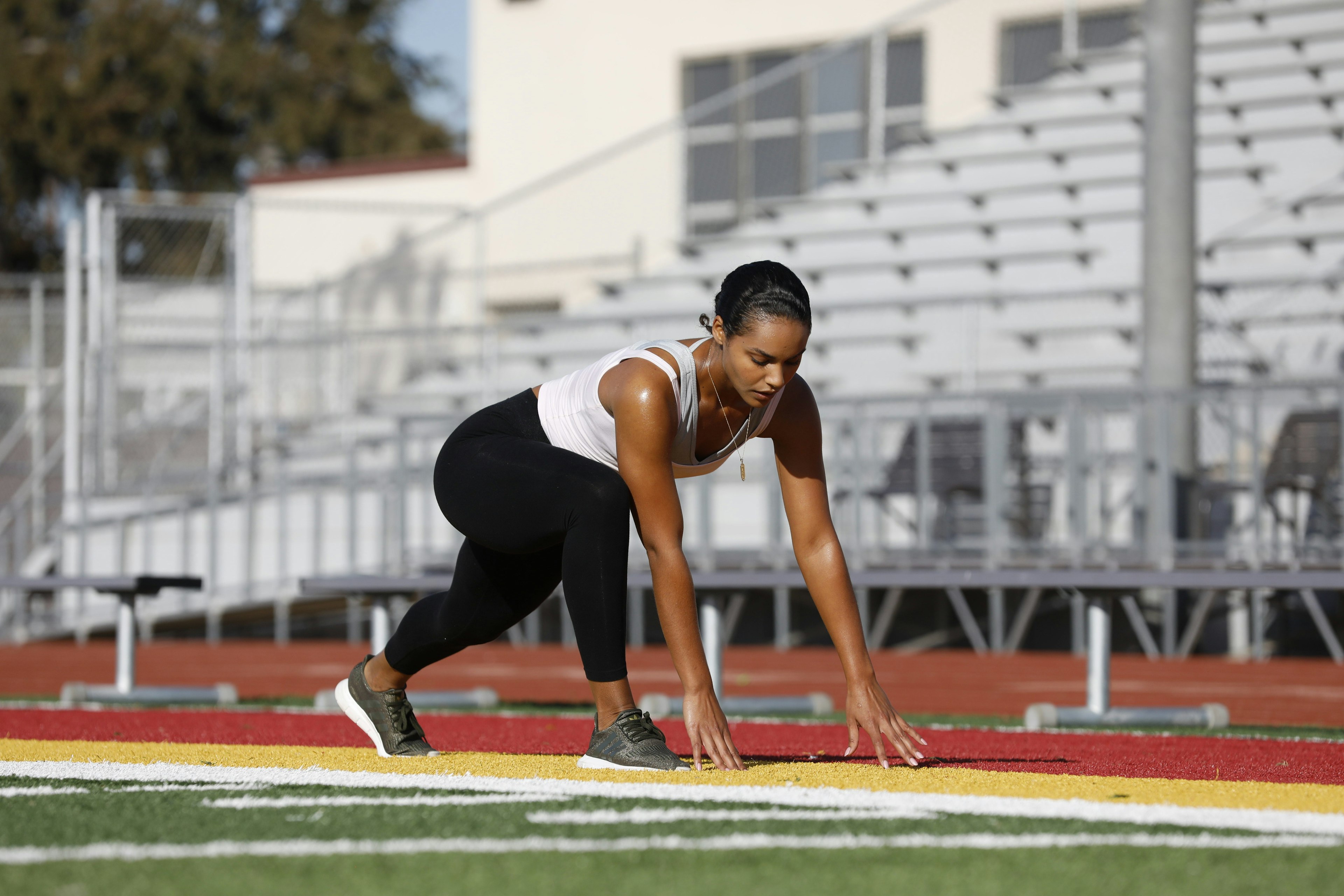 woman on field stretching