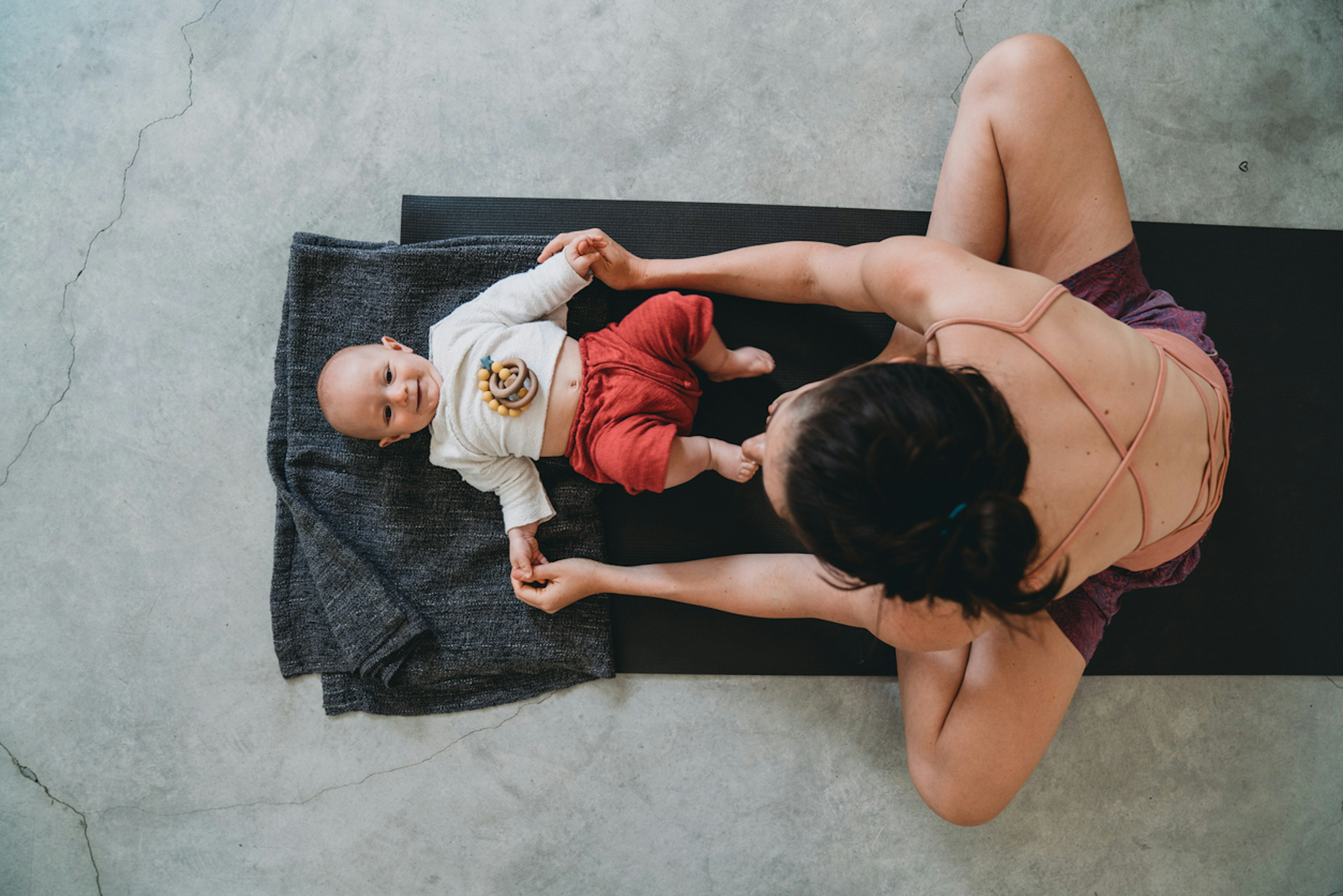 woman exercising with baby
