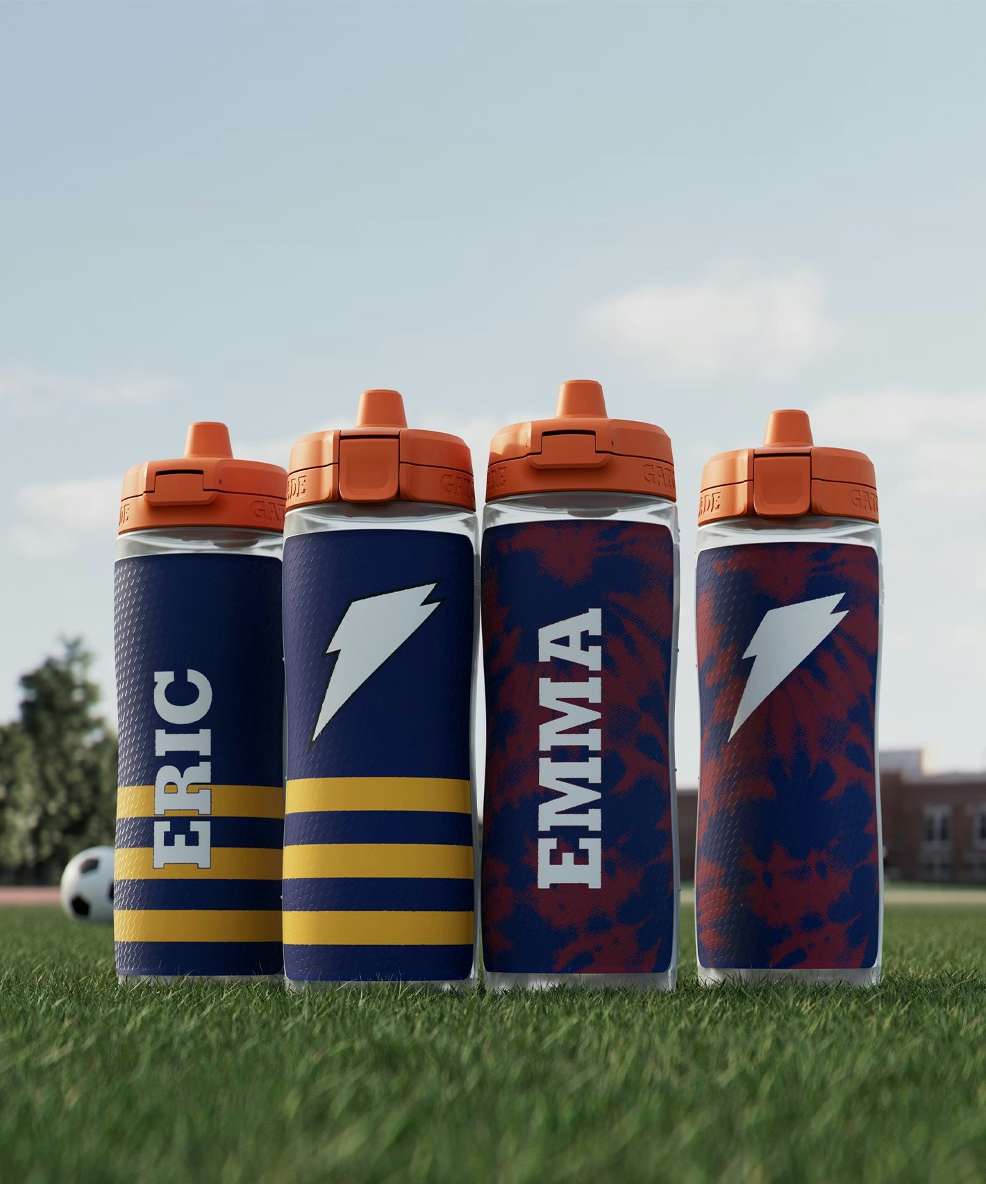 four customized bottles on field