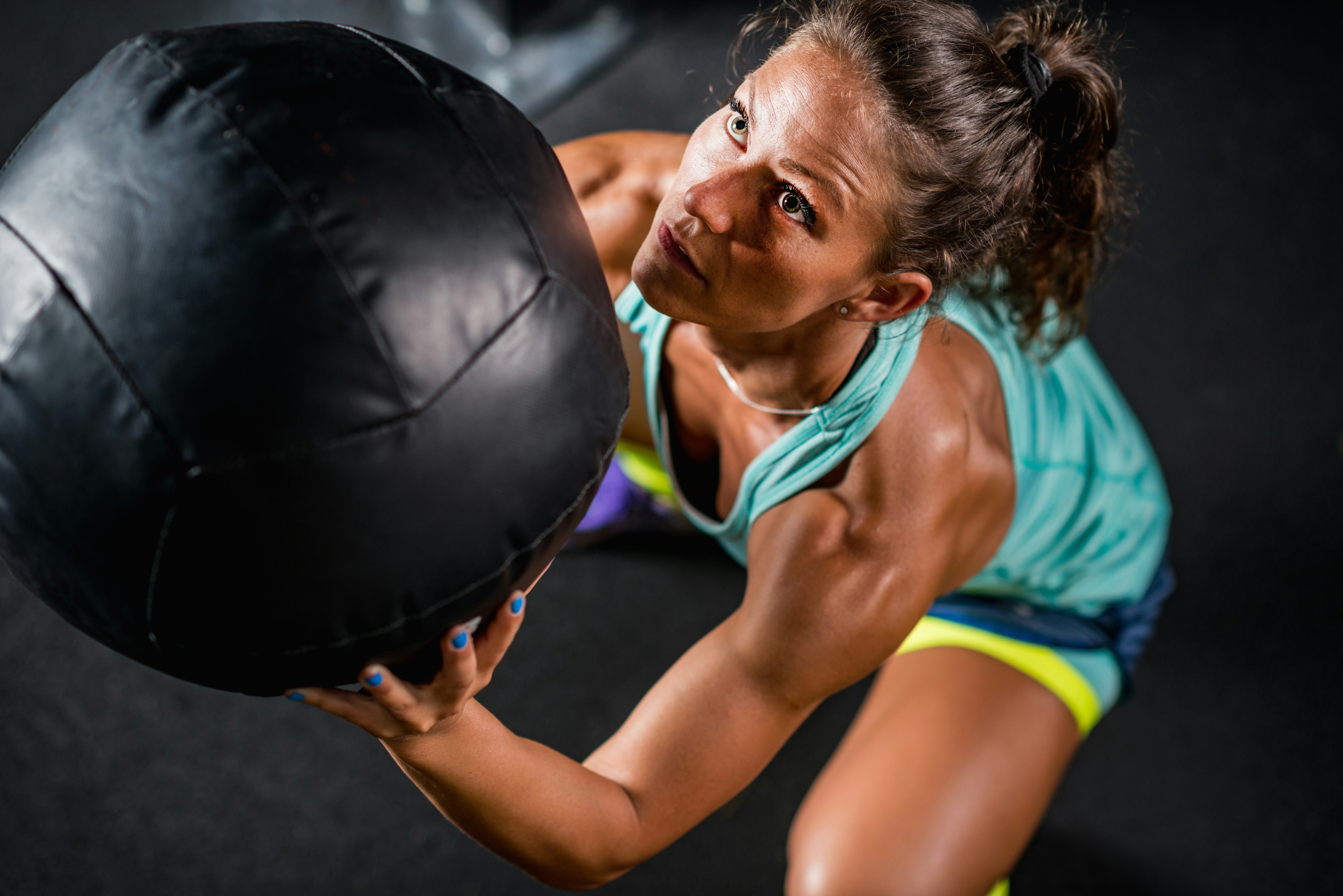 woman working out with medicine ball
