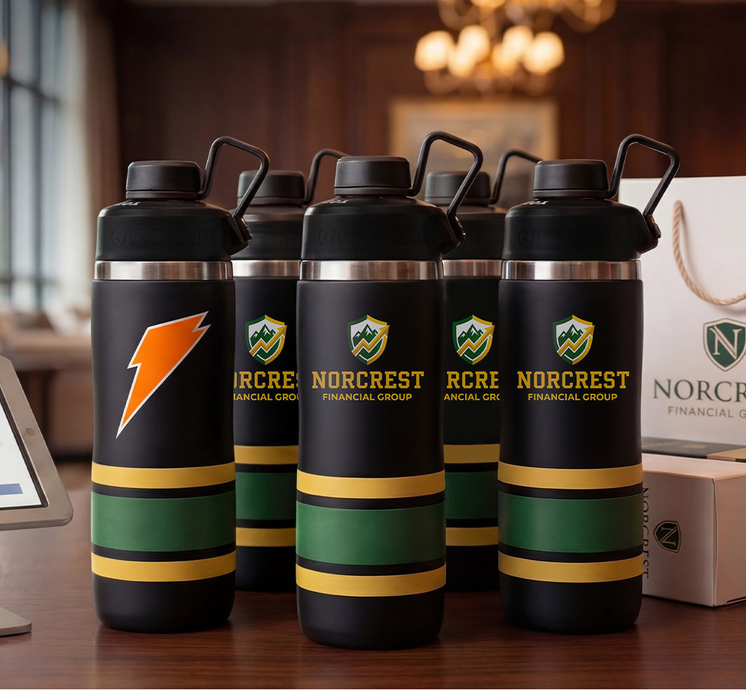 lineup of custom stainless steel bottles with corporate logo on conference room table