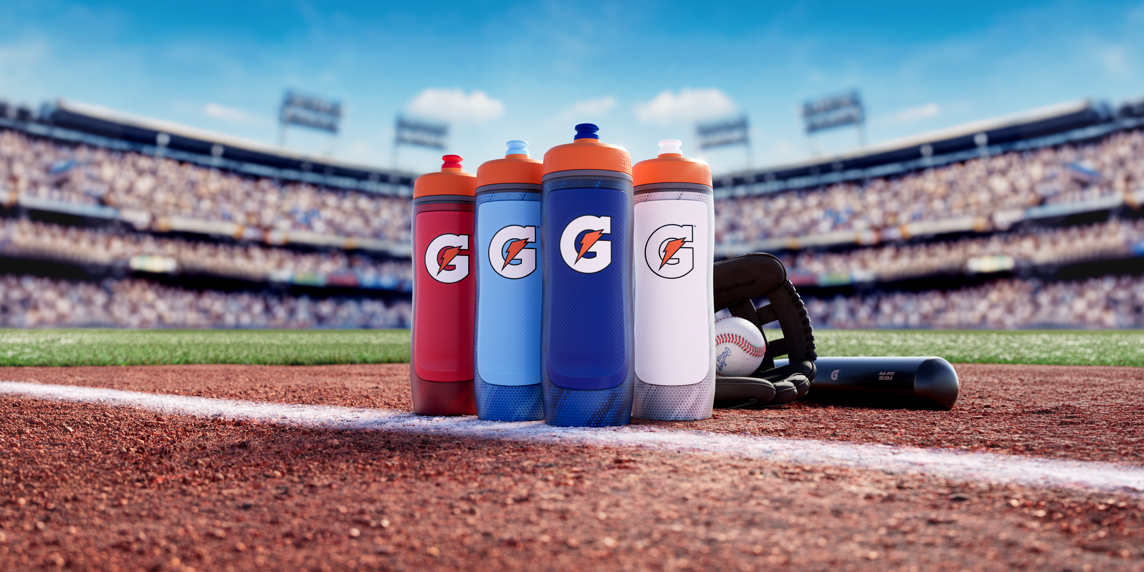 four All Pro bottles (red, light blue, navy blue, white) on baseball field in front of baseball glove