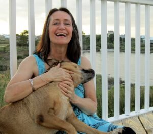 woman with dog smiling