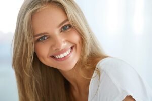 blonde woman smiling with nice white teeth