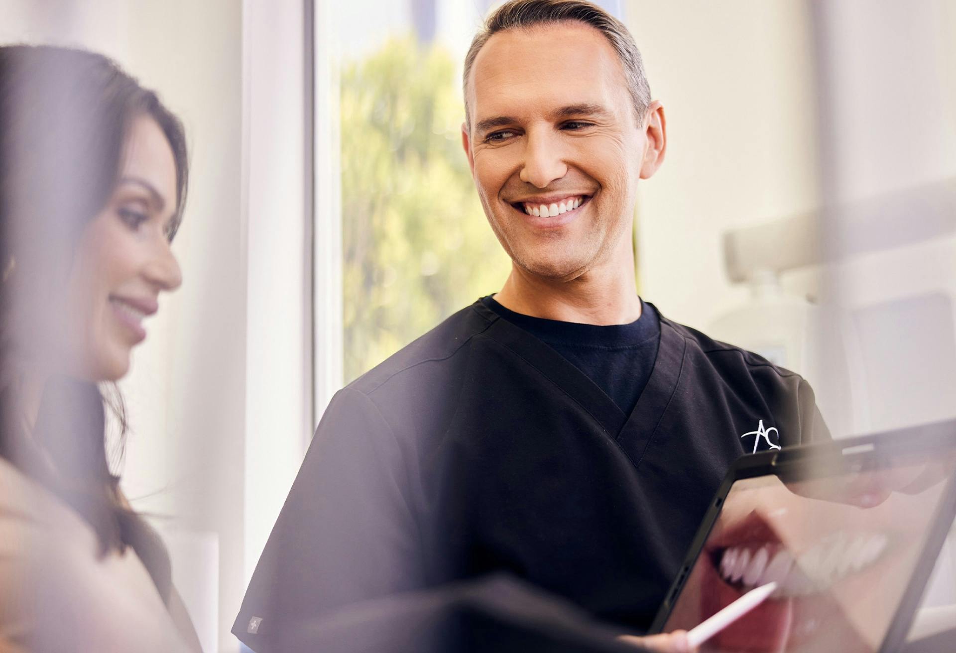 Dr. Glosman speaking with a patient