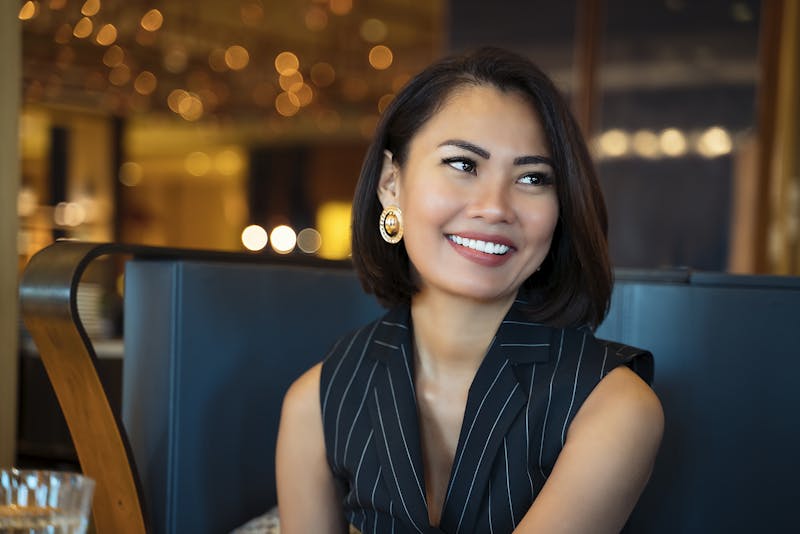Woman sitting down smiling