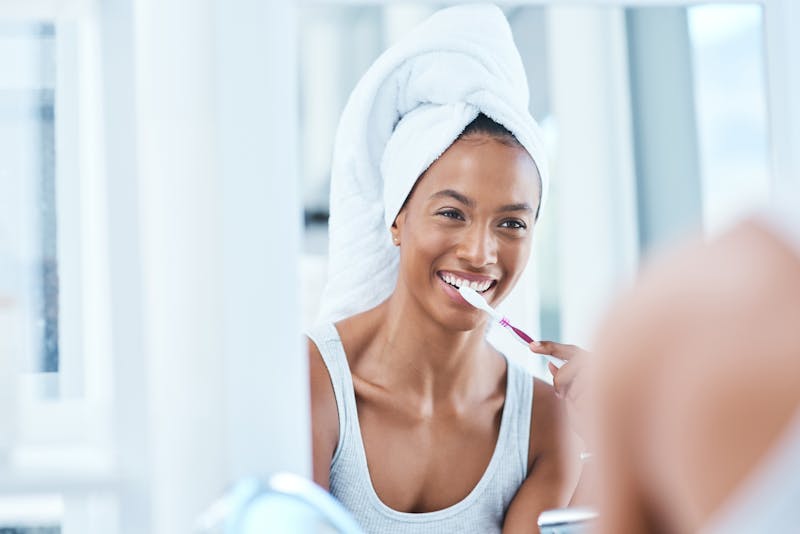 Woman brushing her teeth