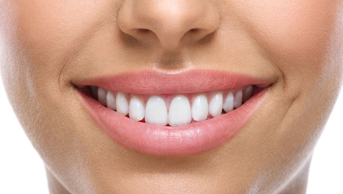 Close up of woman smiling showing white teeth