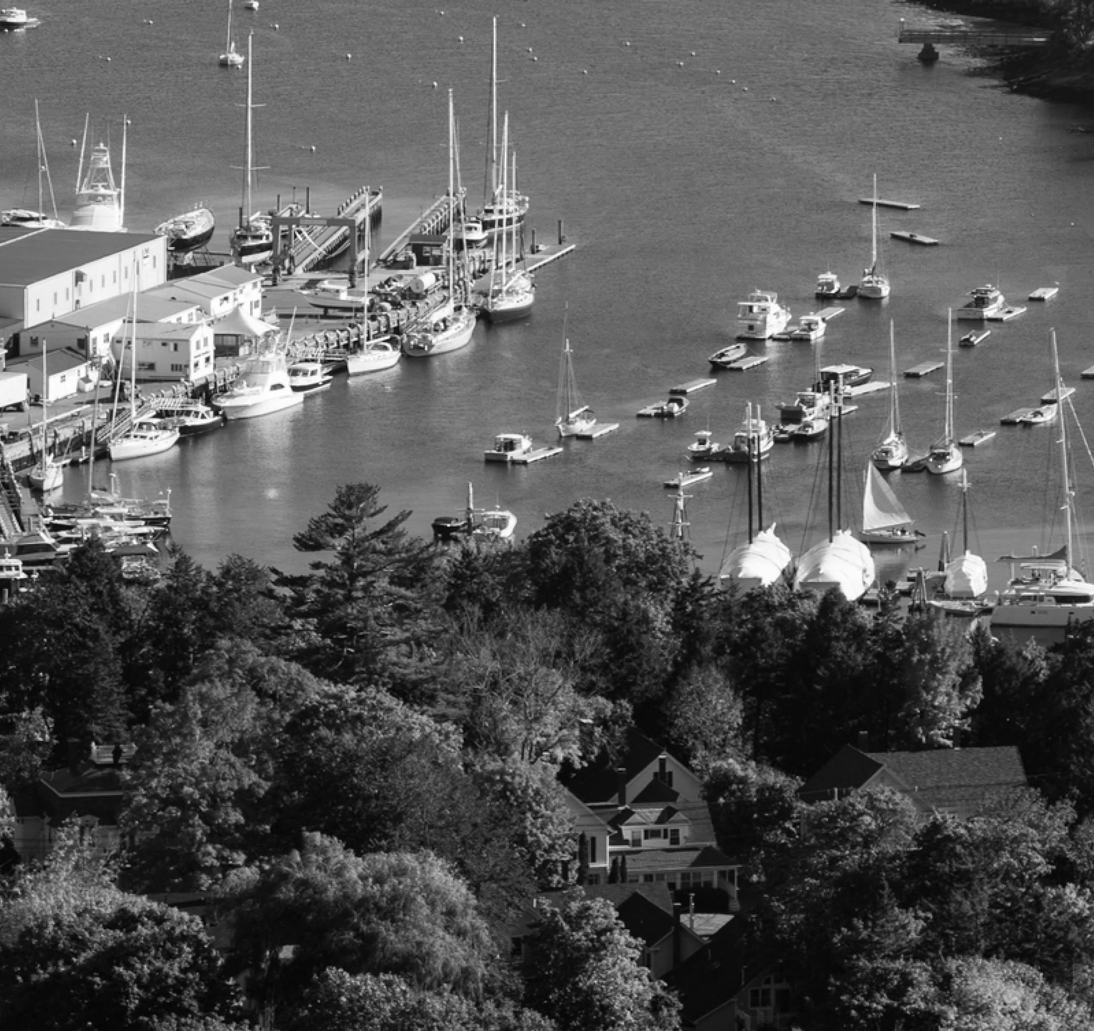 black and white photo of boats and body of water
