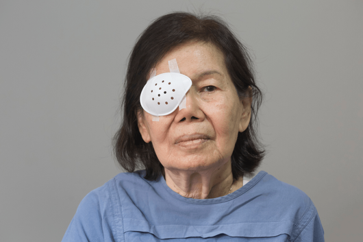 woman with eye covered