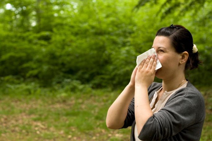 woman blowing her nose